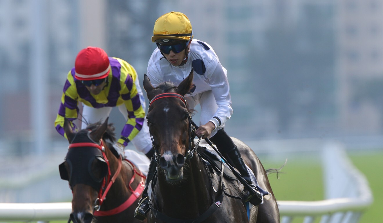Vincent Ho aboard Golden Sixty after winning at Sha Tin.
