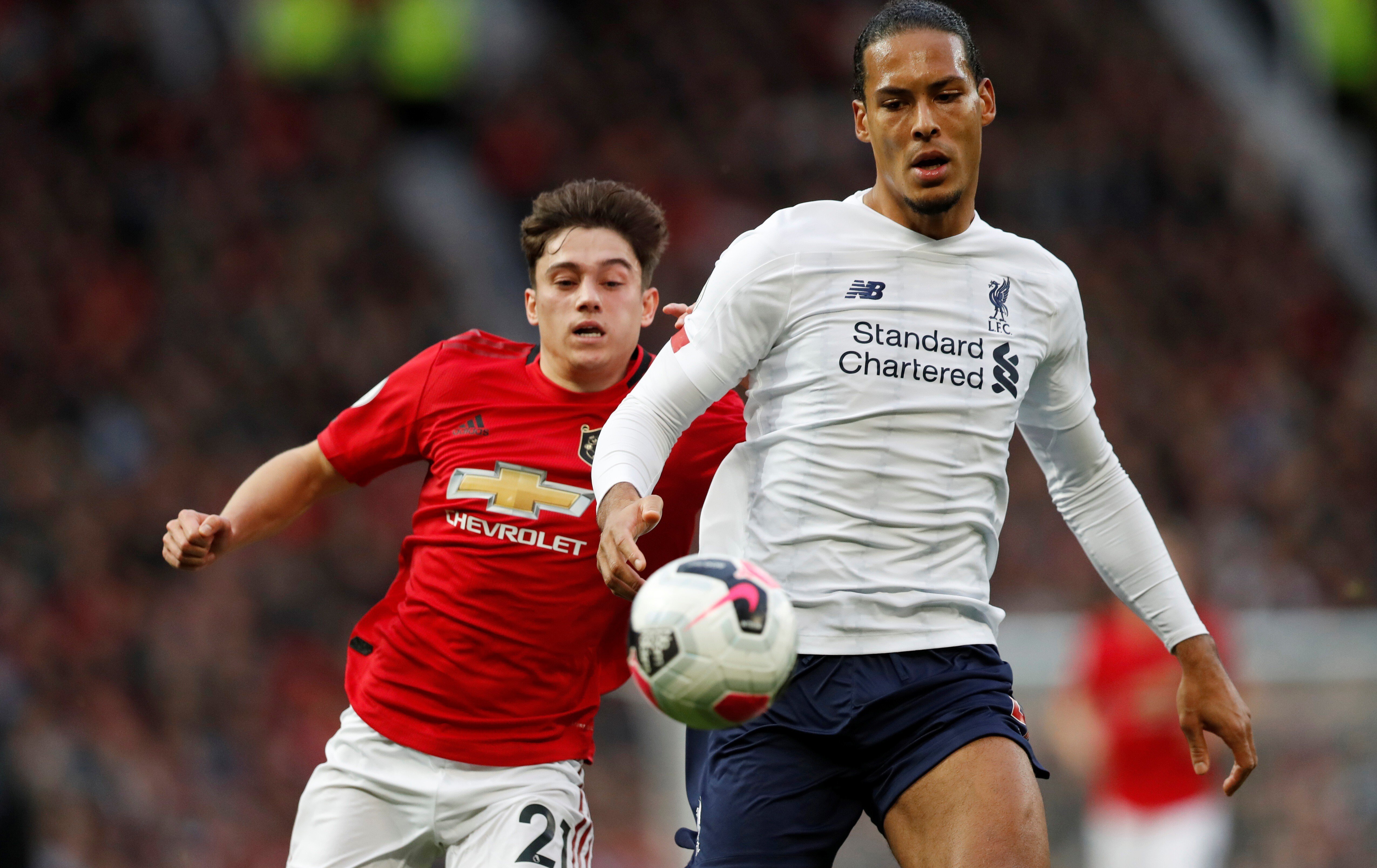 Liverpool's Virgil van Dijk in action with Manchester United's Daniel James. Photo: Reuters