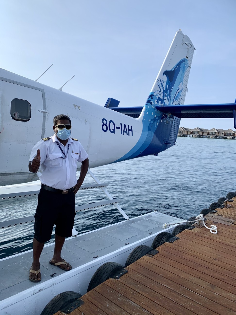 Apart from the mask, seaplane pilots dress much as they have always done. Photo: Lee Cobaj