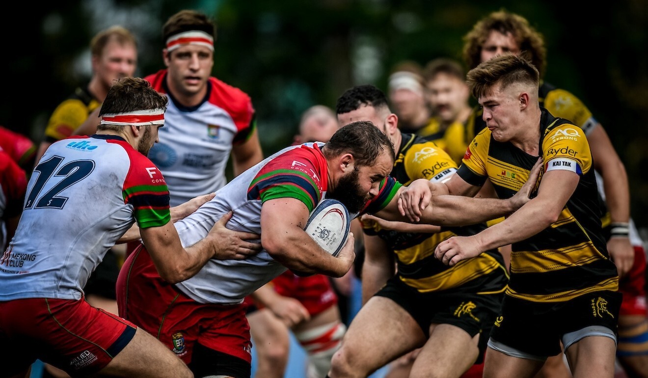 HKU Sandy Bay star Luke van der Smit runs into a powerful Tigers defensive line in the HKRU Premiership round three on Saturday. Photo: Ike Images