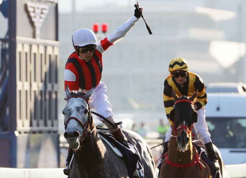 Jockey Masami Matsuoka salutes as Win Bright takes out the 2019 Hong Kong Cup.