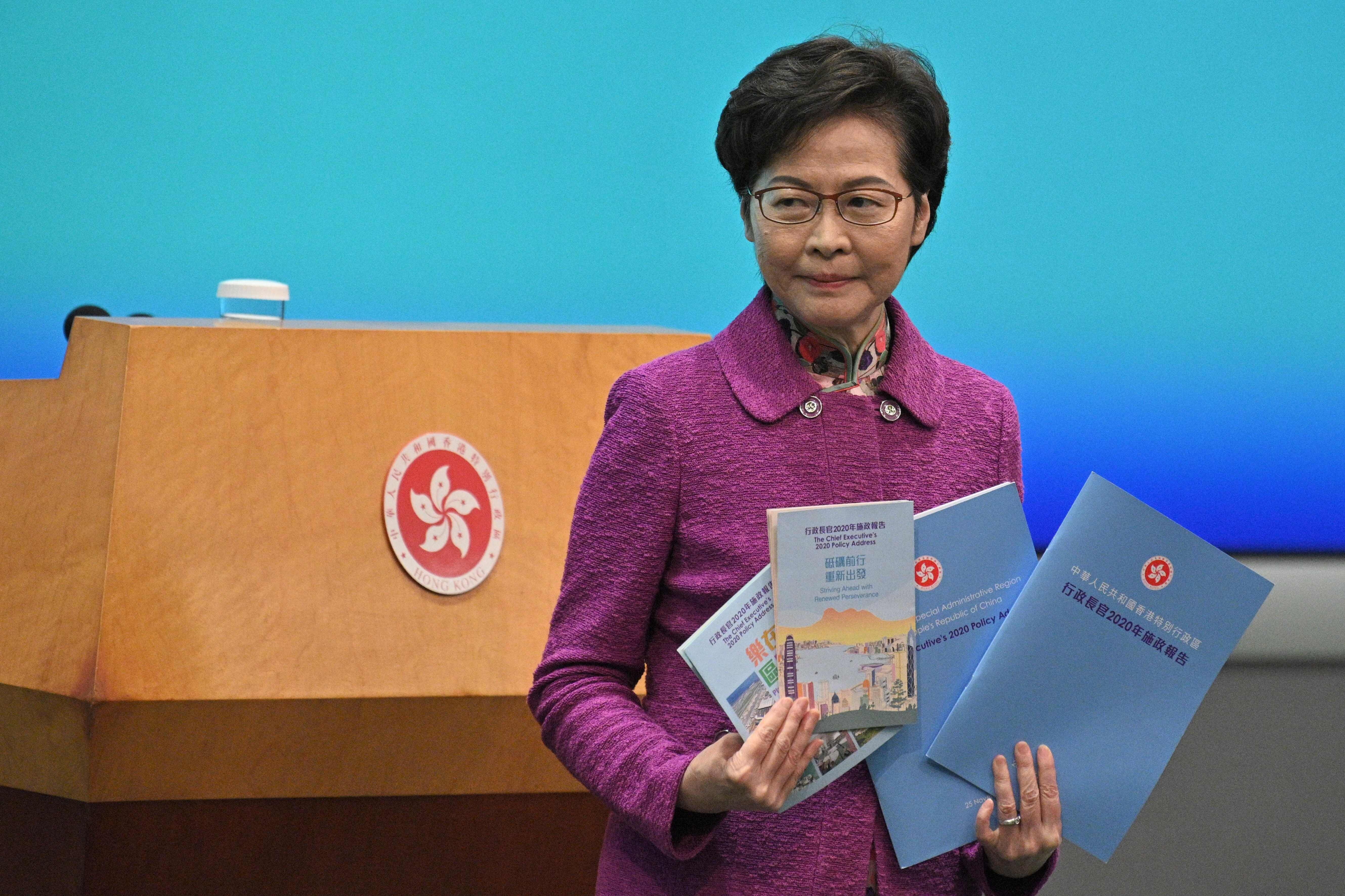 Chief Executive Carrie Lam arrives for a press conference at the Hong Kong government headquarters on November 25, after delivering her annual policy address at the Legislative Council. Photo: AFP