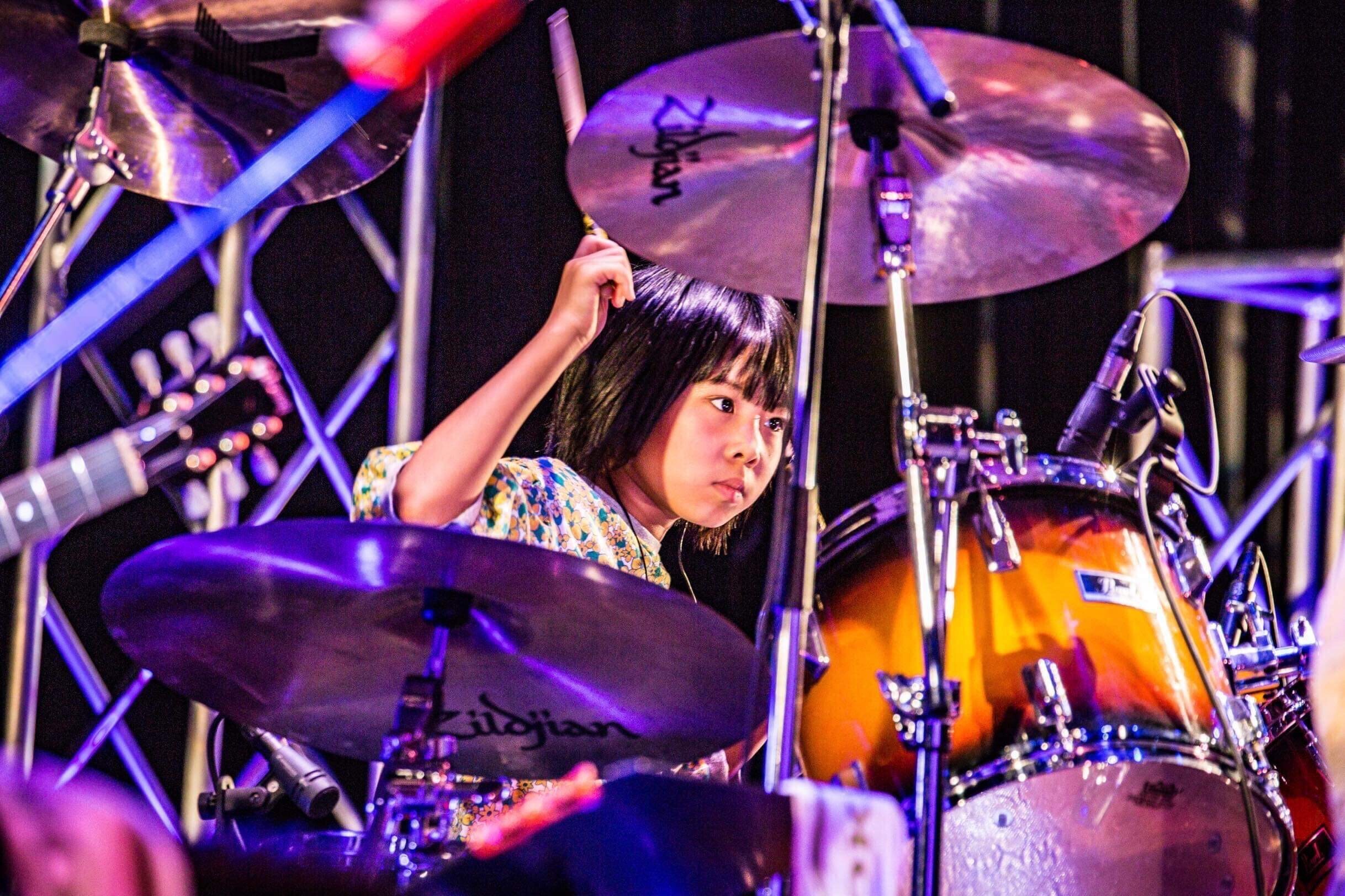 Asian girl drumming led zeppelin