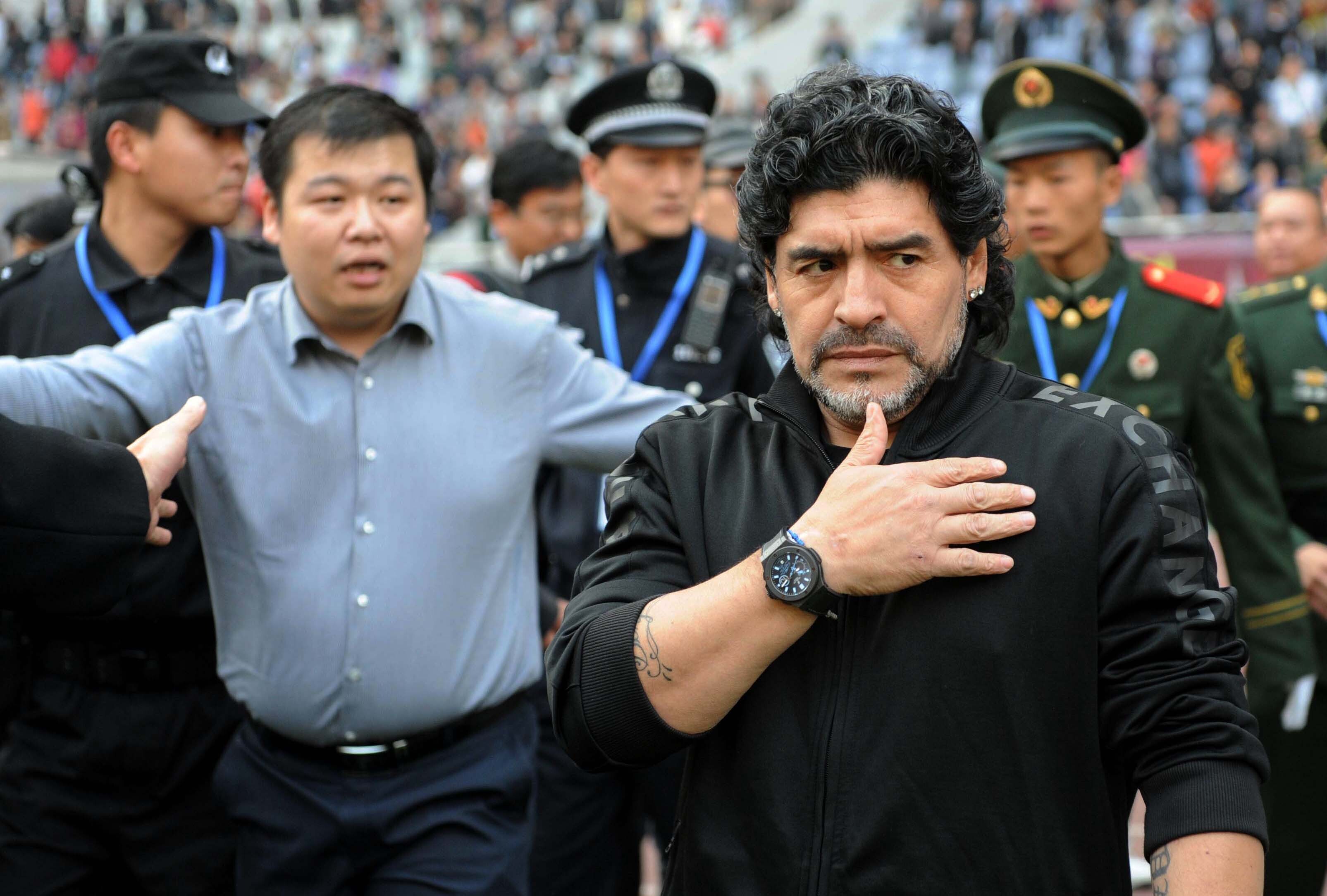 Argentine soccer legend Diego Maradona enters the stadium ahead of a charity football match in Jinan in 2010. Photo: Xinhua