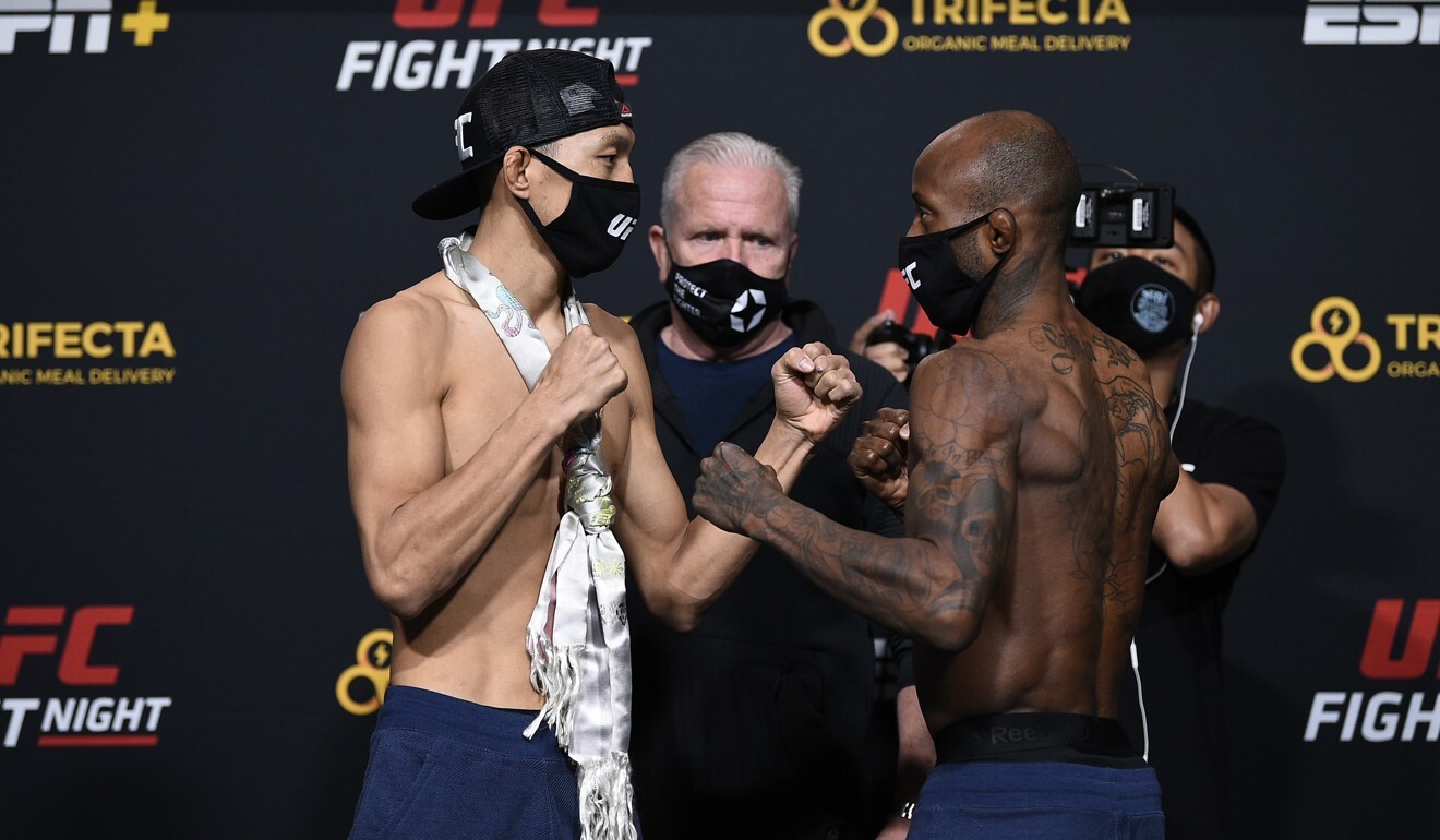 Su Mudaerji and Malcolm Gordon face off during the UFC weigh-in for their fight.