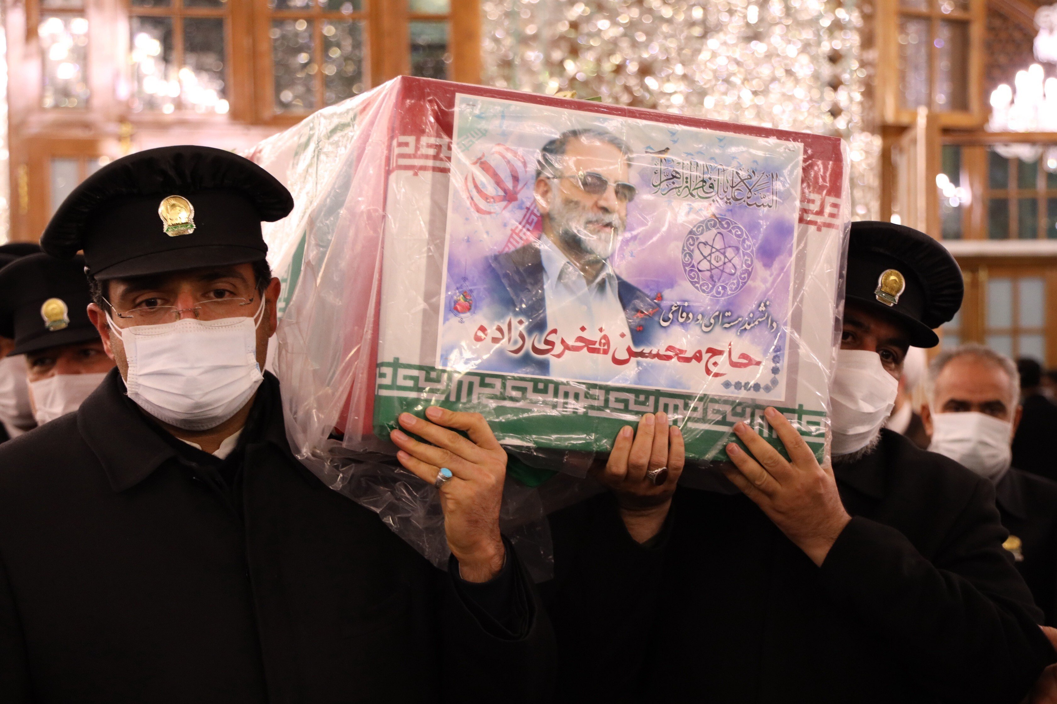 Pallbearers carry the coffin of slain Iranian nuclear scientist Mohsen Fakhrizadeh inside the Shrine of Imam Reza during a funeral ceremony in the city of Mashhad on Sunday. Photo: EPA