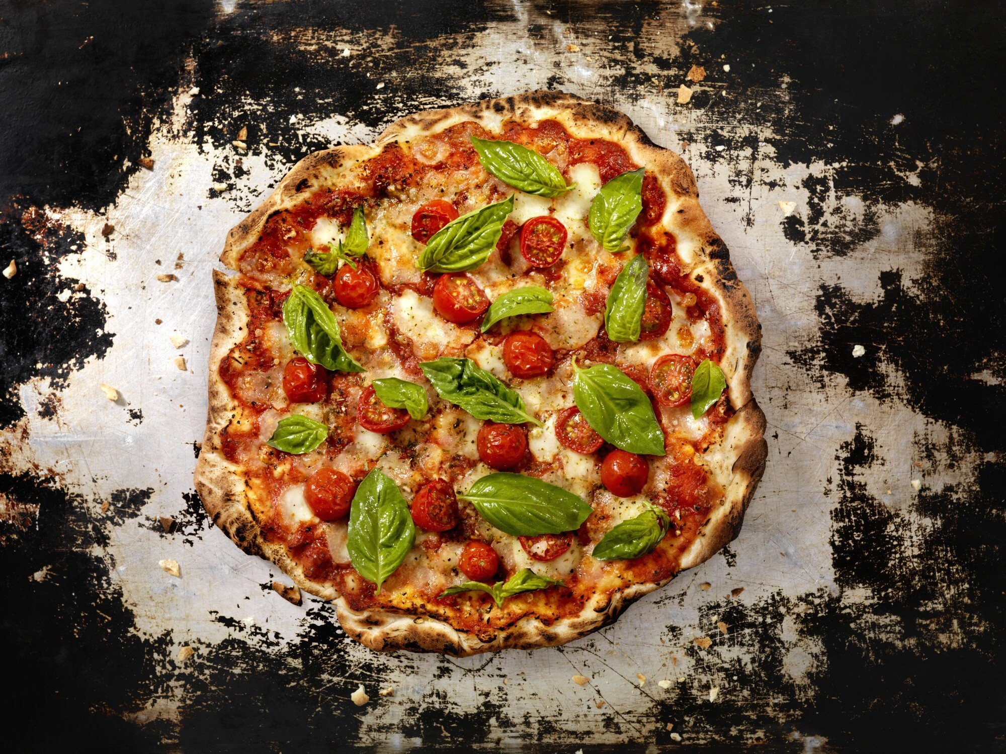 An authentic Neapolitan margherita pizza with mozzarella, tomatoes and basil. Teachers from Naples have shown disciples from Asia how to make the authentic pizza. Photo: Getty Images