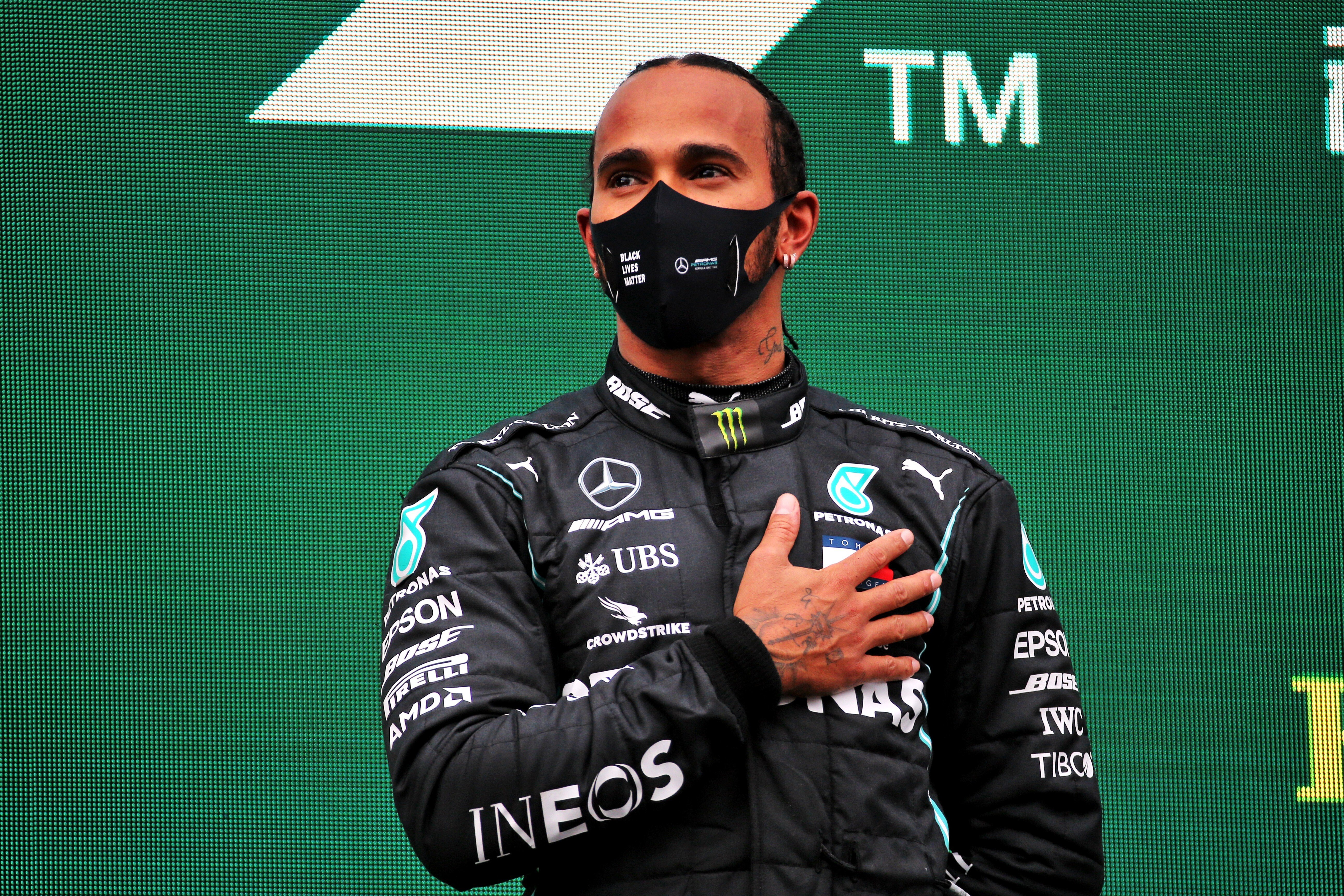 British Formula One driver of the Mercedes AMG Petronas team, Lewis Hamilton, celebrates on the podium after winning the Turkish Grand Prix and securing his seventh world championship. Photo: DPA