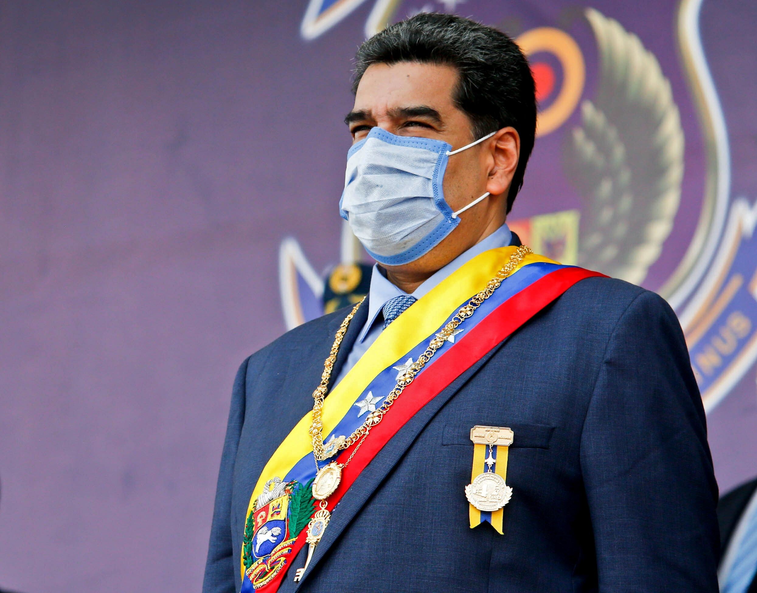 Venezuela's President Nicolas Maduro wearing a face mask at a ceremony in Maracay, Aragua state, Venezuela on Friday. Photo: Venezuelan presidency via AFP