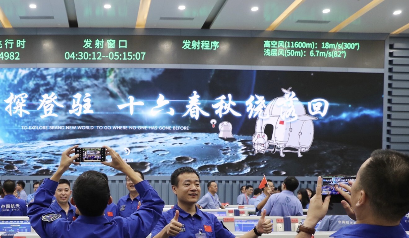 Technicians celebrate after the Chang’e 5 lifts off from the Wenchang launch site in the southern Chinese province of Hainan on November 24. Photo: Xinhua