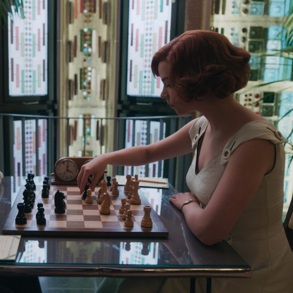 Heath Ledger on the right in a chess game