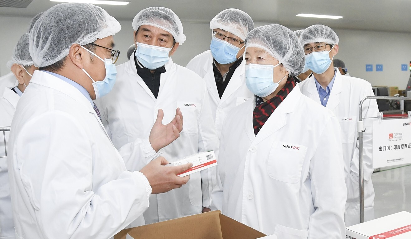 Vice Prime Minister Sun Chunlan (right) told vaccine manufacturers to prepare for mass production.  Photo: Xinhua