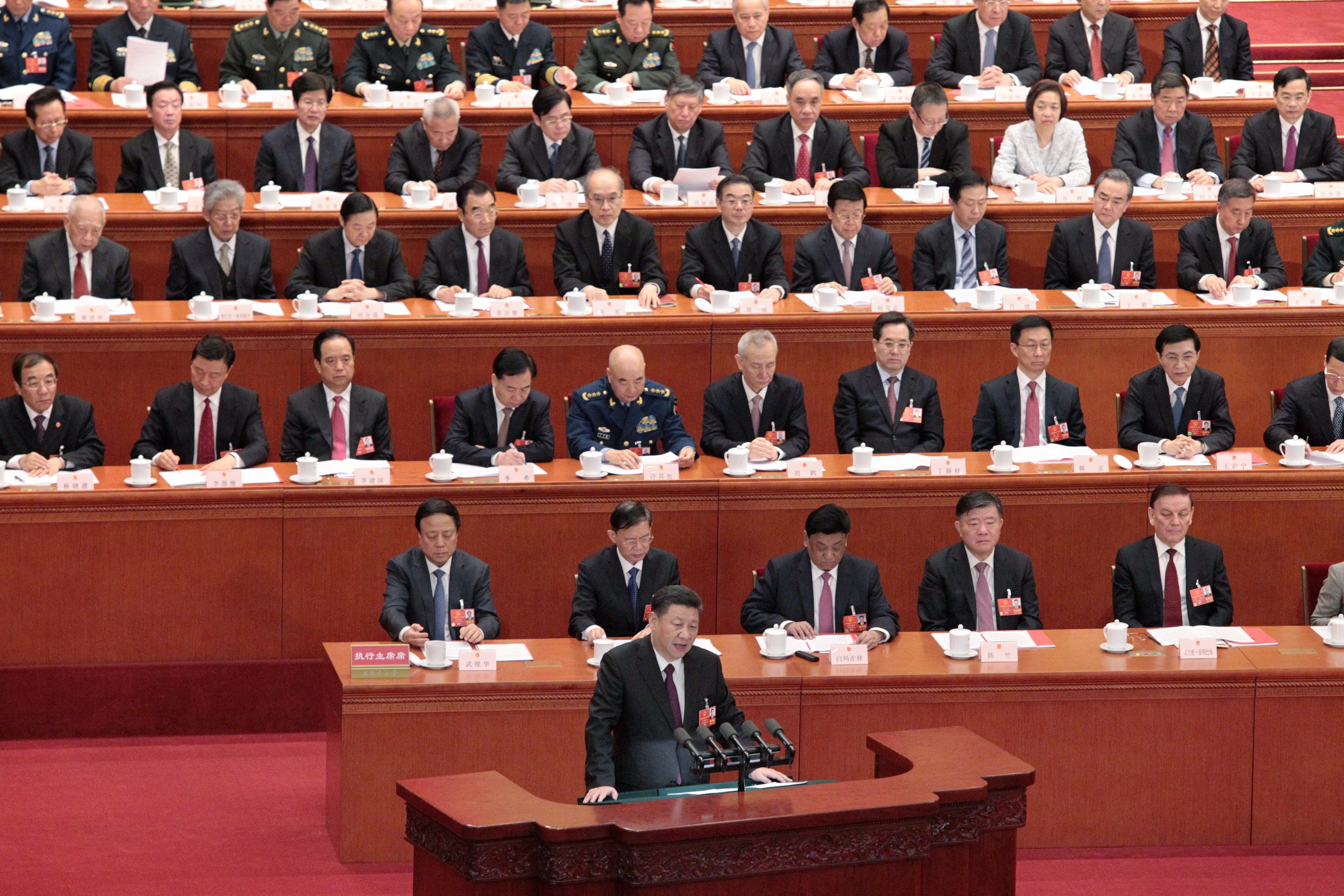 Chinese President Xi Jinping speaks at the Great Hall of the People in Beijing, surrounded by Communist Party members. Photo: Simon Song