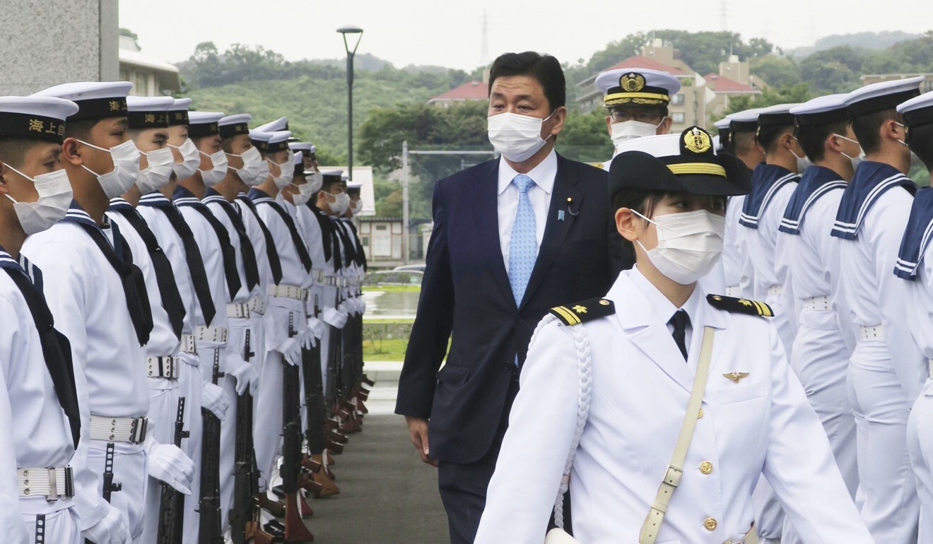 Japanese Defence Minister Nobuo Kishi inspects sailors of the Japan Maritime Self-Defense Force. Photo: Kyodo