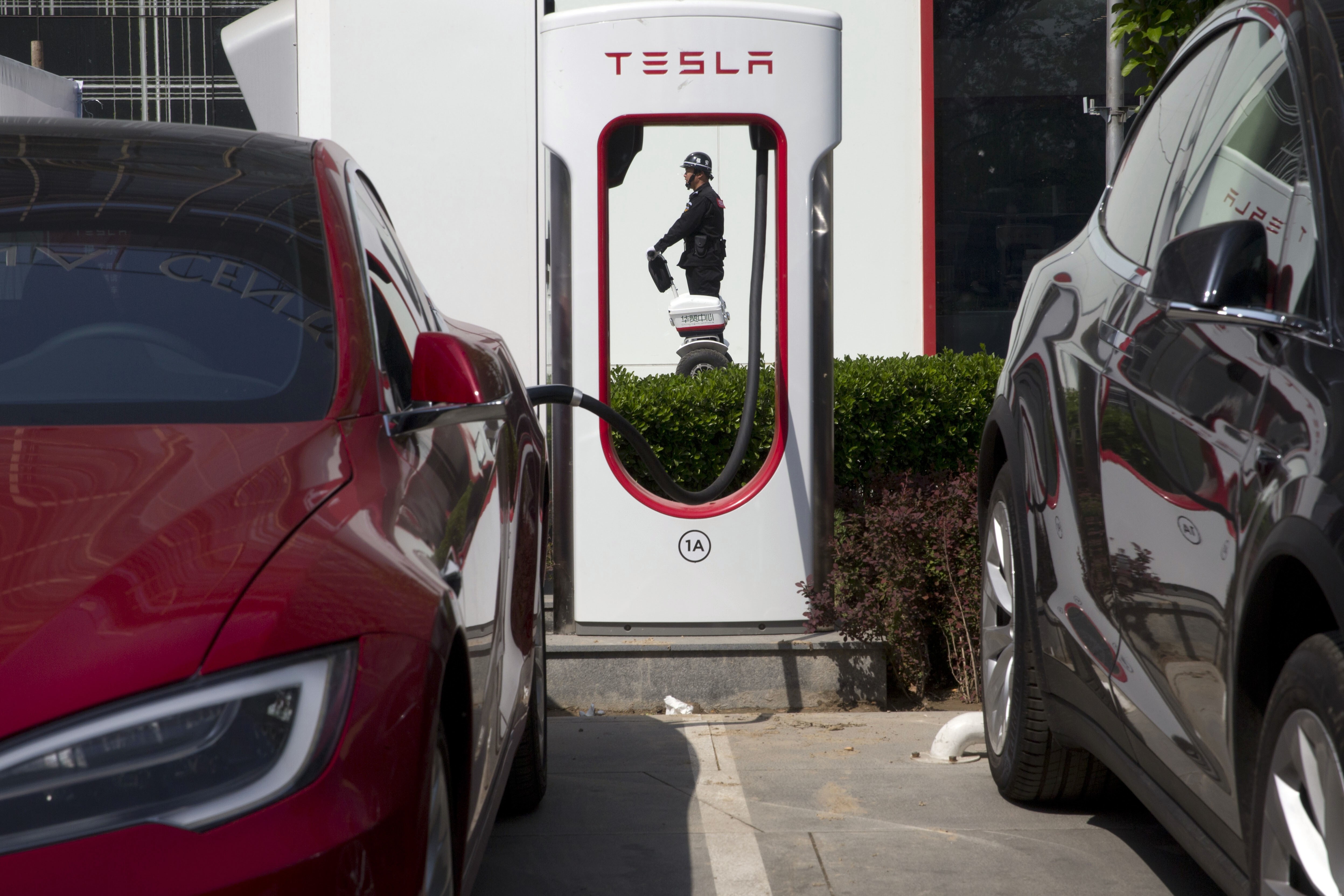 A Tesla electric vehicle charging station in Beijing. The supercharger station in Zhongshan is expected to open in January. Photo: AP
