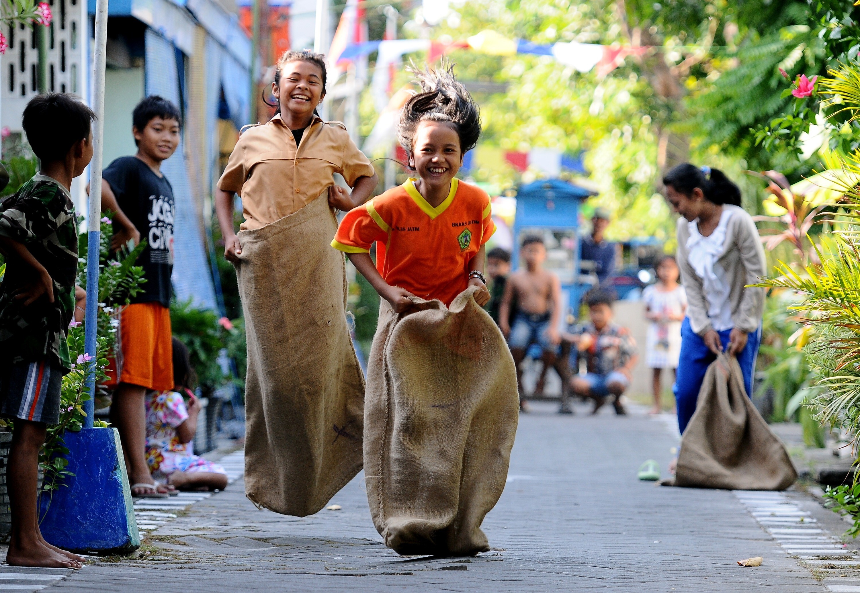 A sack race in Surabaya, Indonesia. Traditional games and toys are having a revival in Indonesia. Photo: Robertus Pudyanto/Getty Images