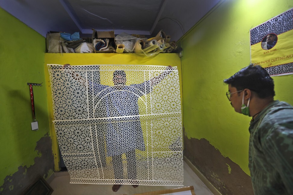 Soni shows a section of his work at home. Photo: AP