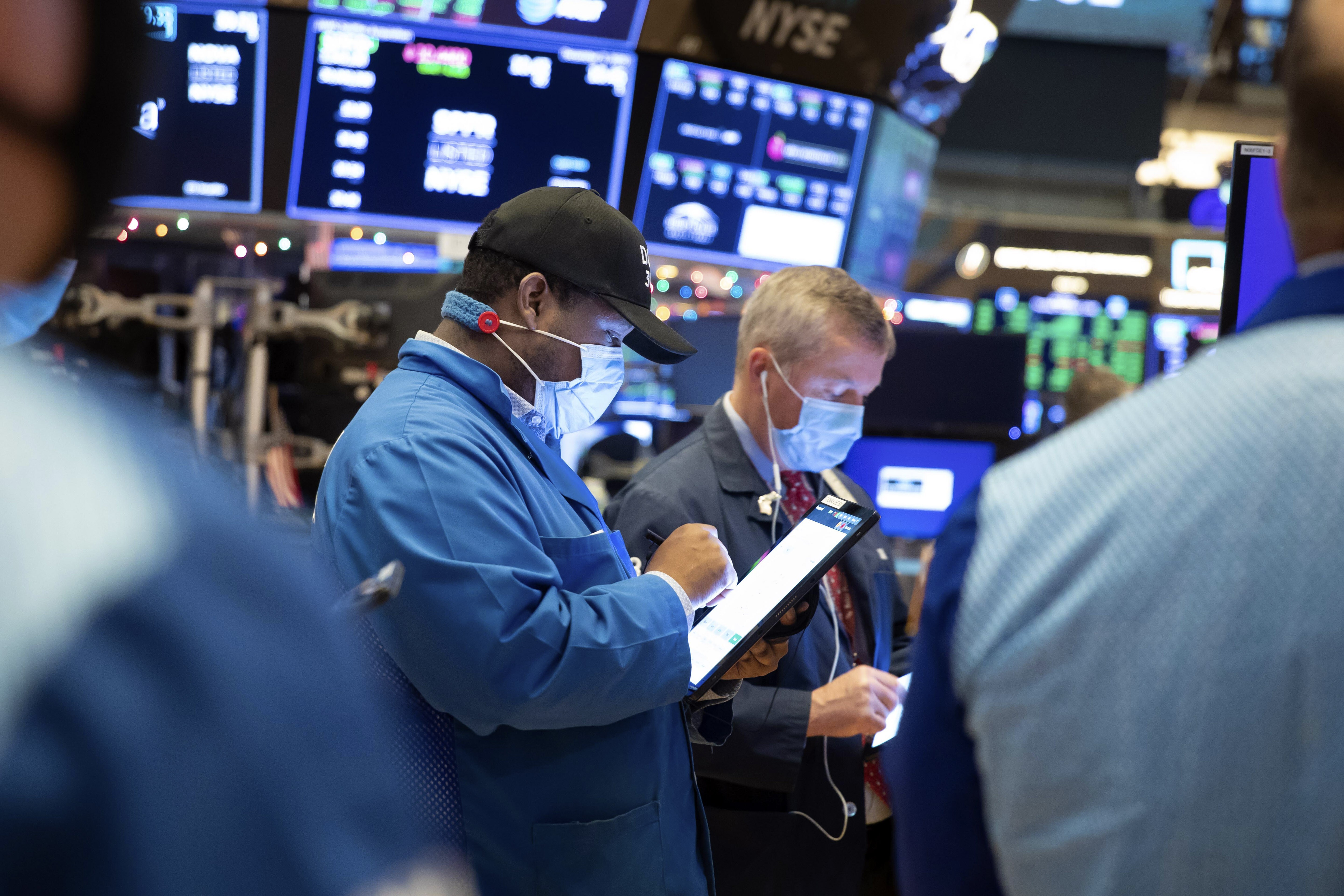 Traders work on the floor of the New York Stock Exchange. Photo: New York Stock Exchange/ AP