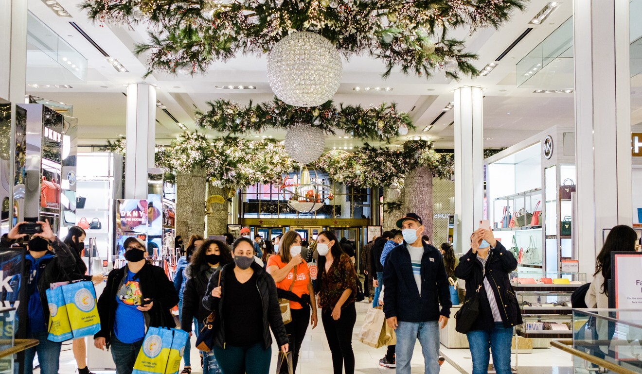 Shoppers walk through Macy’s flagship store in New York on November 27. The US retail sector lost 35,000 jobs during the month. Photo: Bloomberg
