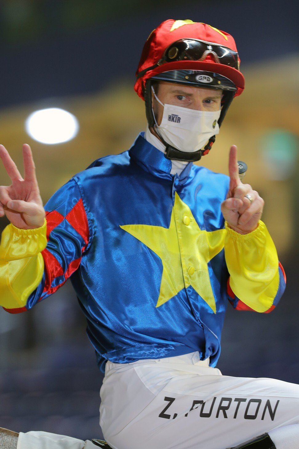 Zac Purton celebrates his 1,200th Hong Kong win on Wednesday night.