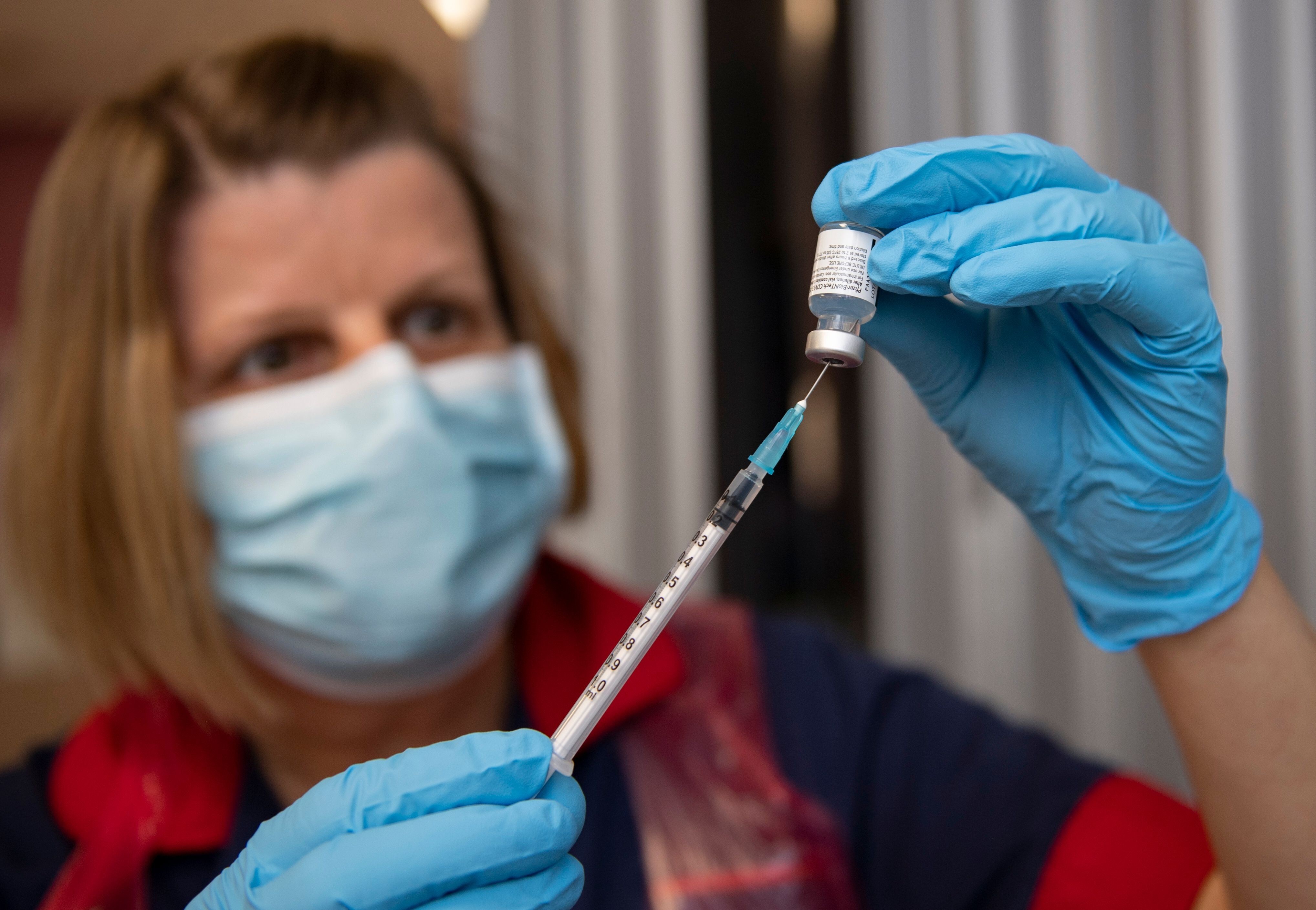 A nurse prepares a dose of the Pfizer-BioNTech Covid-19 vaccine at the Northern General Hospital in Sheffield, UK, on December 8. Photo: AFP