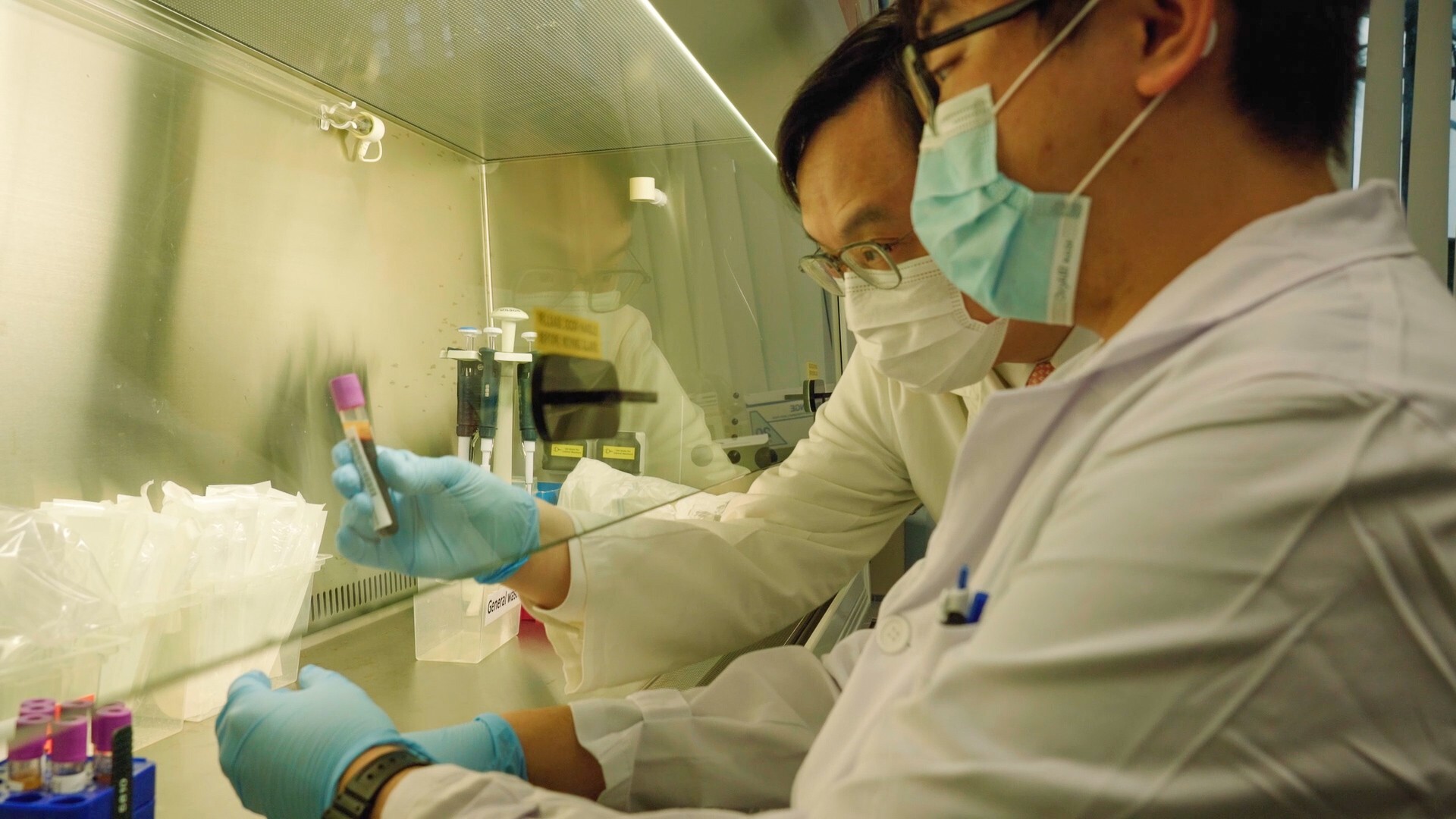 Dennis Lo (left), professor of medicine and chemical pathology at Chinese University of Hong Kong, has developed a blood test that can detect 50 types of cancer from just one sample, which gives patients the chance to undergo medical treatment when survival rates are high.