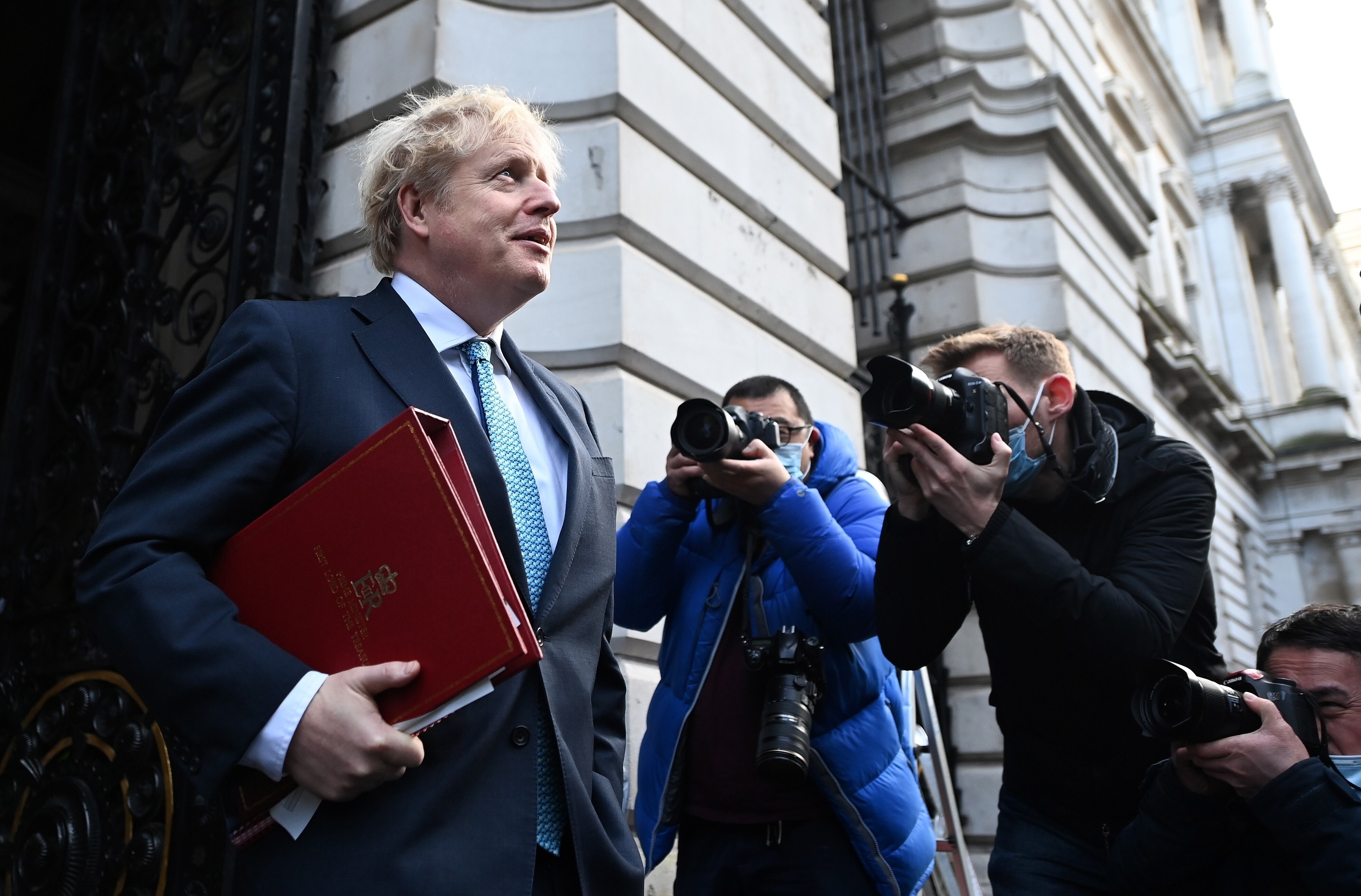 British Prime Minister Boris Johnson, shown leaving 10 Downing Street on Tuesday, has invited India, South Korea and Australia to take part in the G7 summit meeting next year. Photo: EPA-EFE