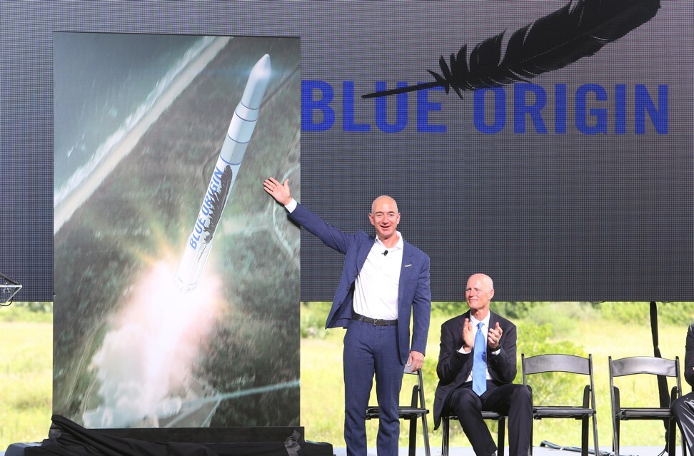 Amazon CEO and Blue Origin founder Jeff Bezos (left) debuts a launch vehicle in September 2015. Photo: Getty Images