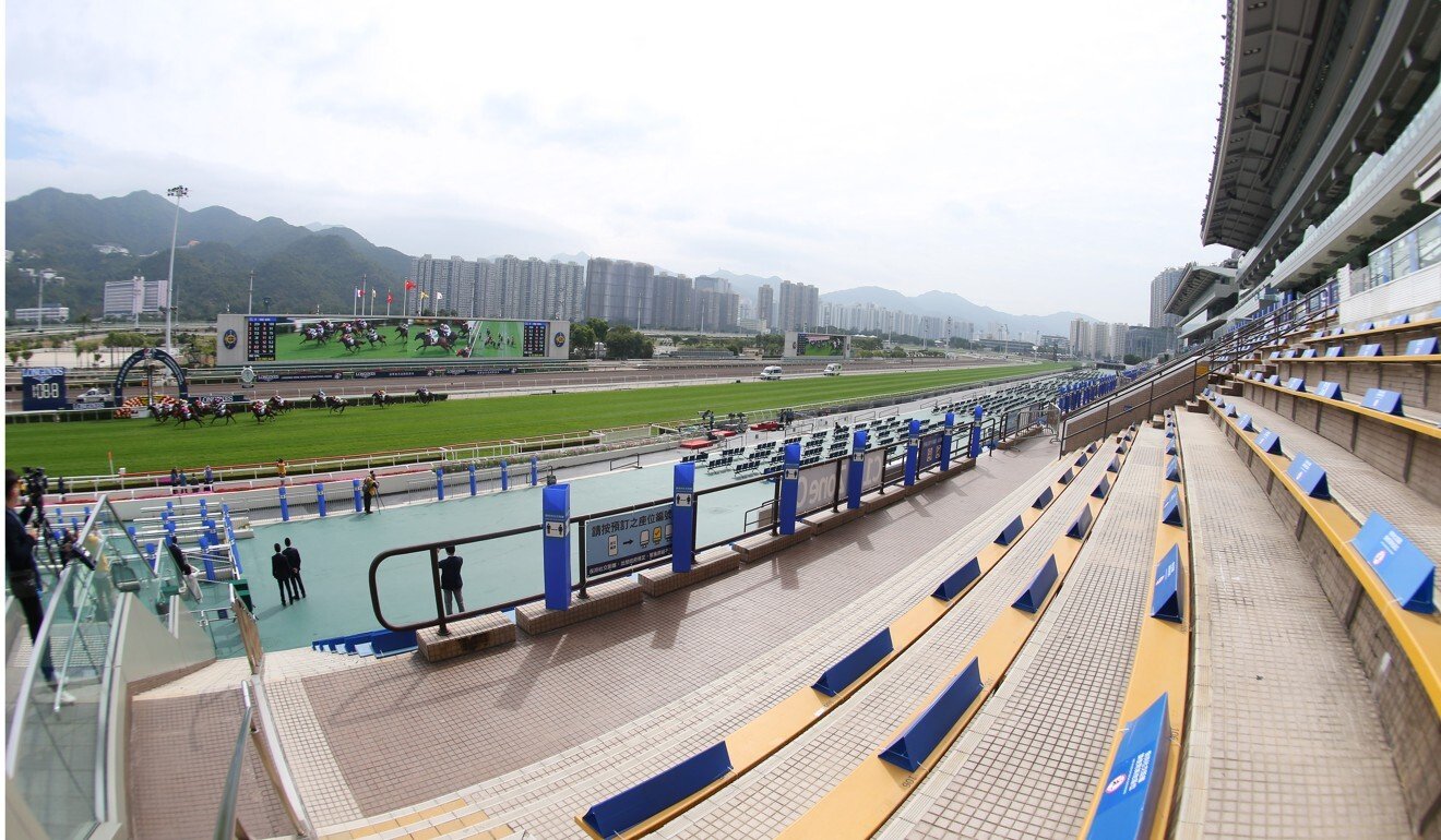 The stands are empty as horses run at Sha Tin on Sunday.