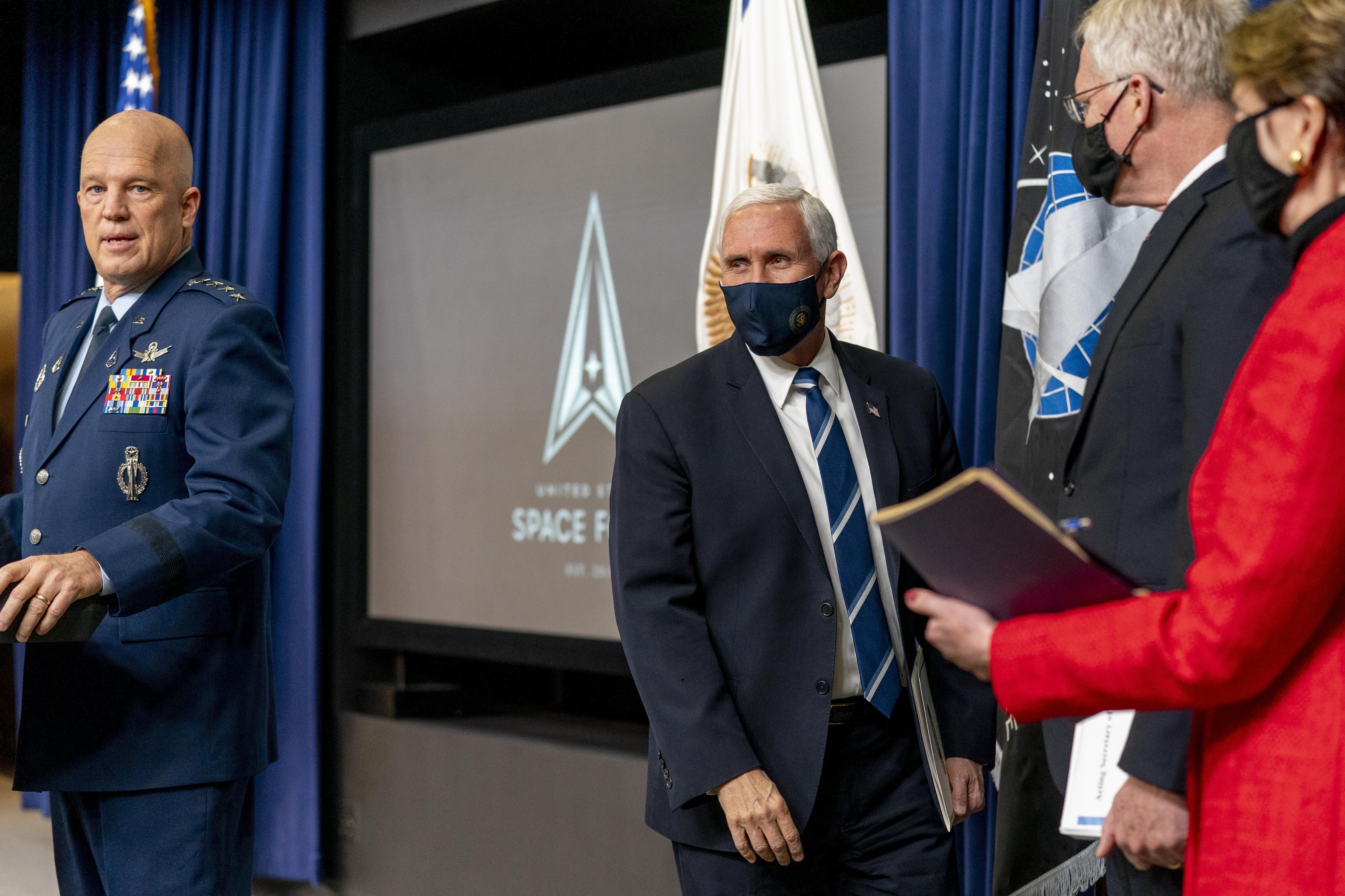 Vice-President Mike Pence, accompanied by Chief of Space Operations at US Space Force General John Raymond, left, Acting Defence Secretary Chris Miller, second from right, and Secretary of the Air Force Barbara Barrett, right. Photo: AP