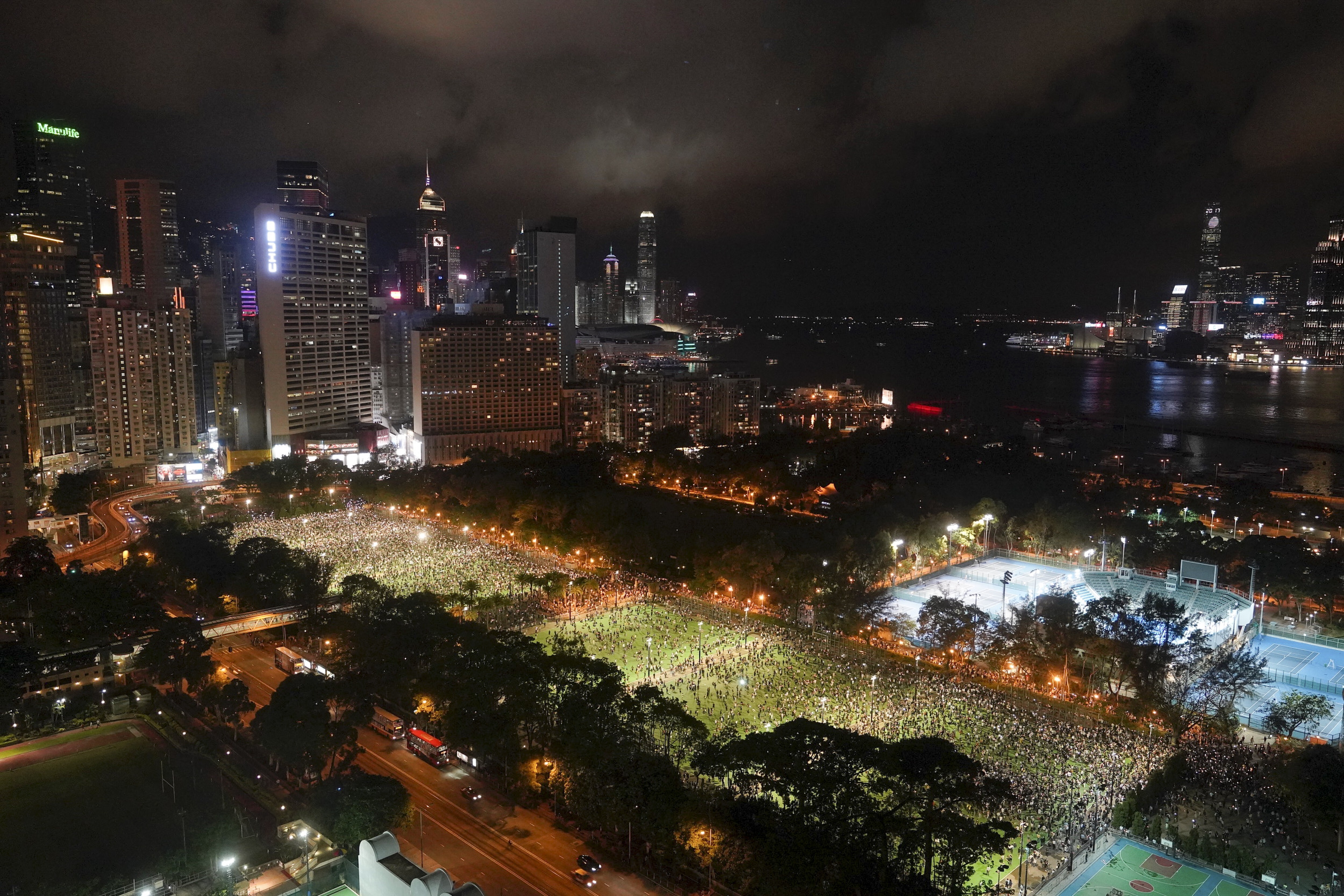 People gather for a vigil for the victims of the 1989 Tiananmen Square Massacre at Victoria Park in Causeway Bay, Hong Kong on June 4. Photo: AP