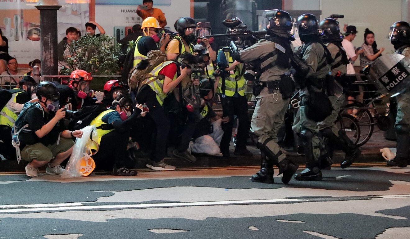 Anti-riot police aim at a group of media personnel in Mong Kok during a clearance operation last year. Photo: Edmond So