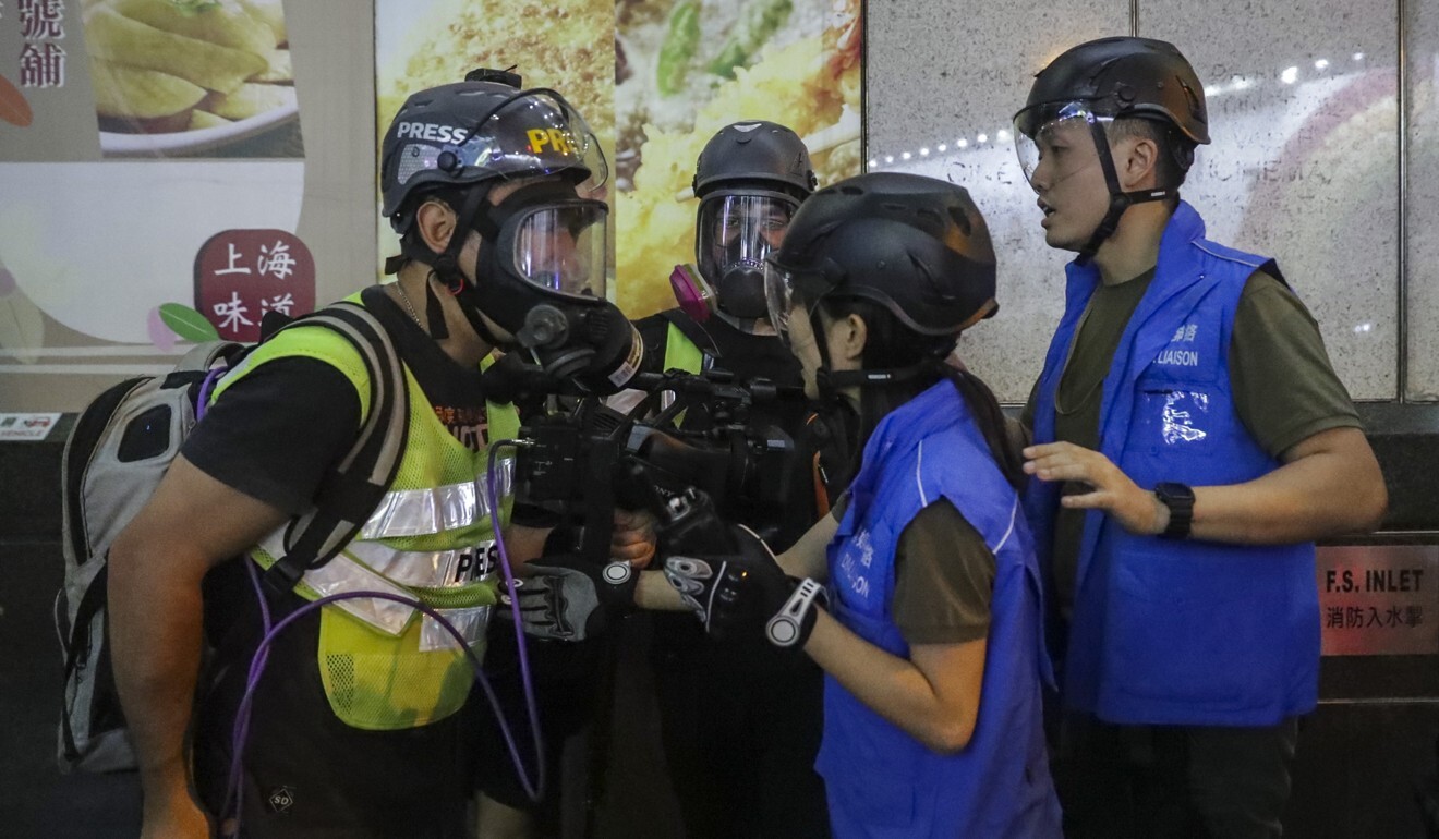 Journalists quarrel with media liaison police officers in Prince Edward during a clearance operation in October of 2019. Photo: Edmond So