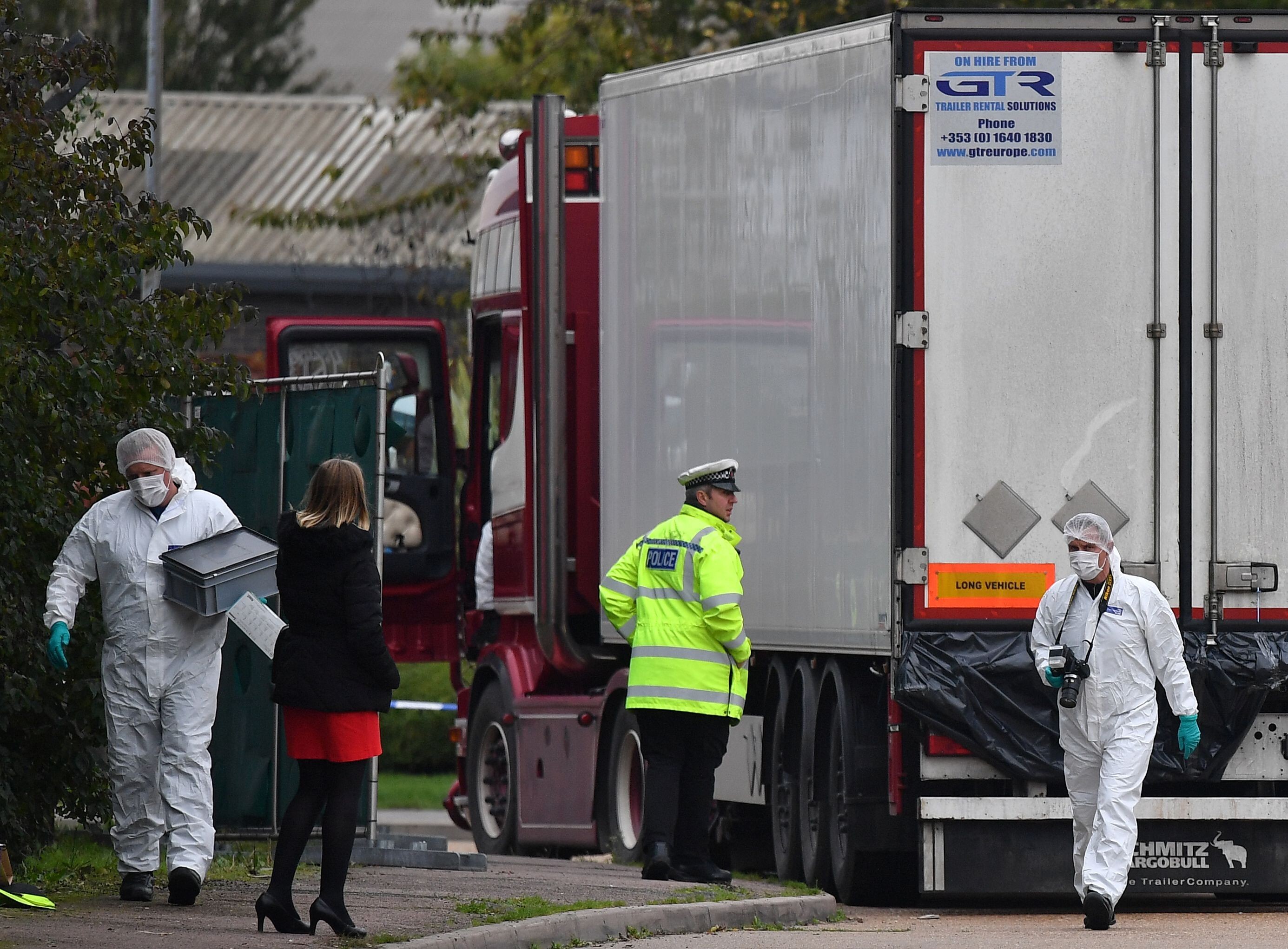 British forensics officers work on the truck, which was found to contain the bodies of 39 people, at an industrial estate east of London on October 23, 2019. Photo: AFP