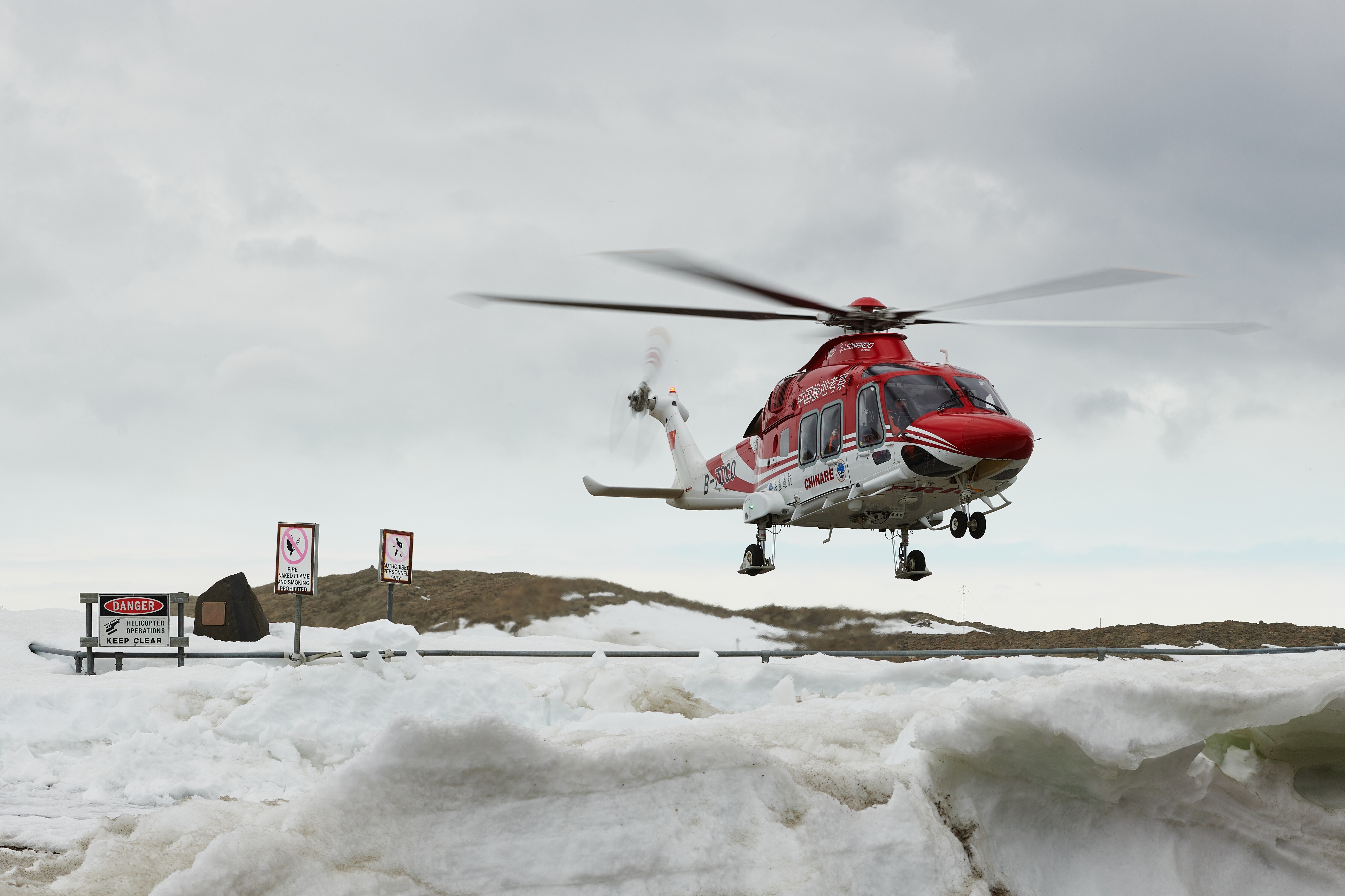 A Chinese helicopter lands at Davis research station as part of the medevac operation. Photo: Dan Dyer