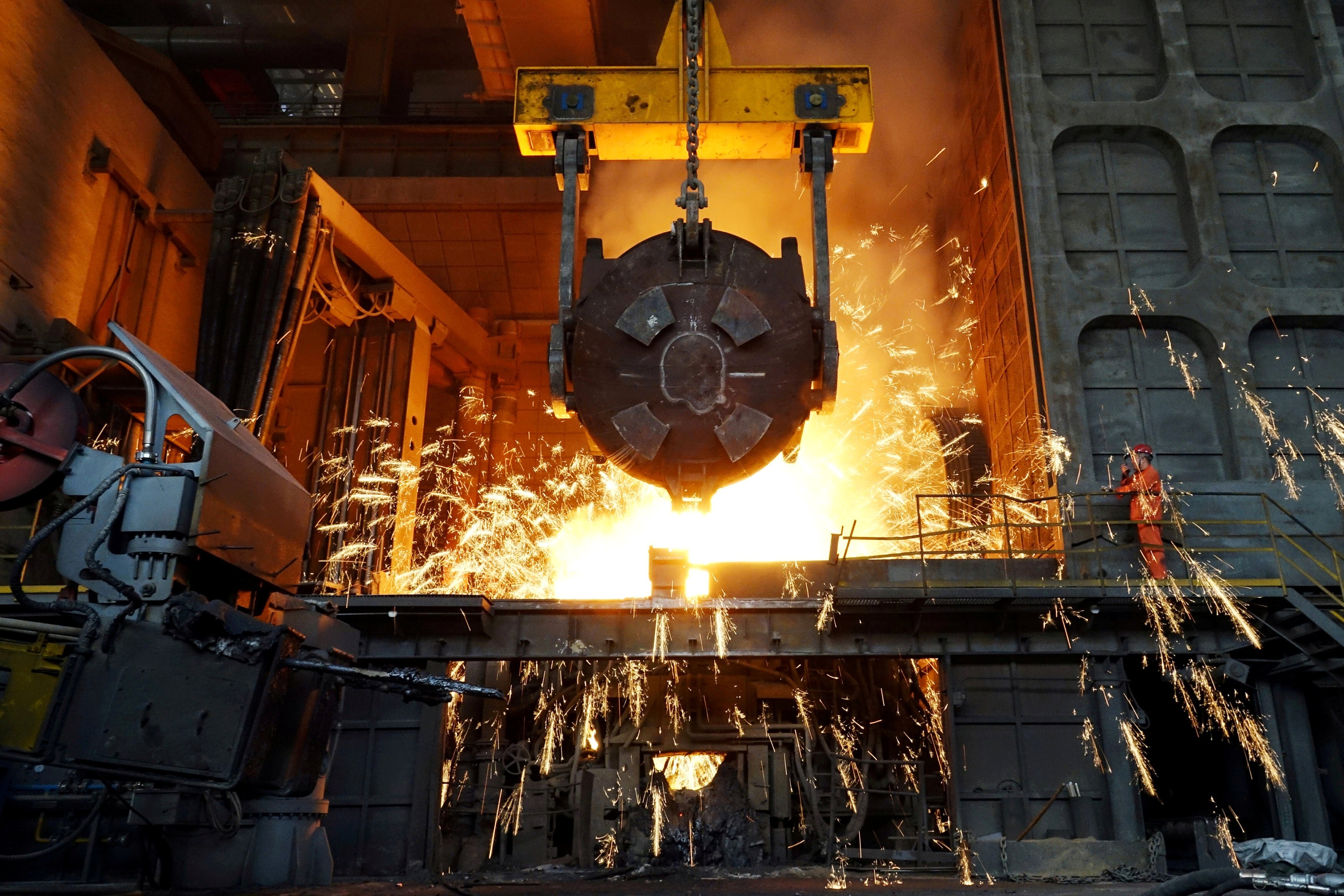 A worker operates a steel plant furnace of the Dalian Special Steel Company in Liaoning province. Photo: Reuters