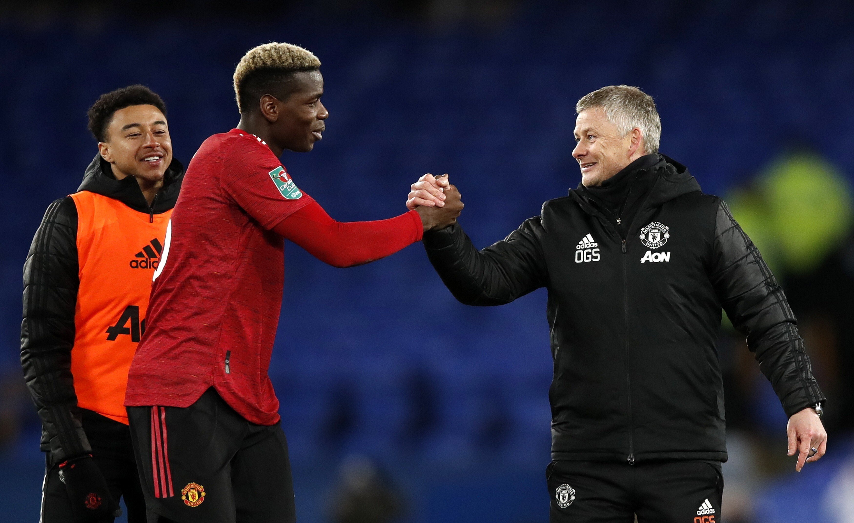Manchester United manager Ole Gunnar Solskaer clasps hands with Paul Pogba after the Carabao Cup quarter-final victory over Everton on December 23. Photo: EPA
