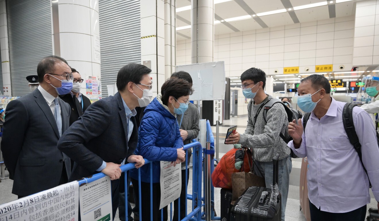 Chief Executive Carrie Lam speaks with Hongkongers returning home during a tour of the immigration facilities at Shenzhen Bay Control Point and the Hong Kong-Zhuhai-Macau Bridge. Photo: Handout