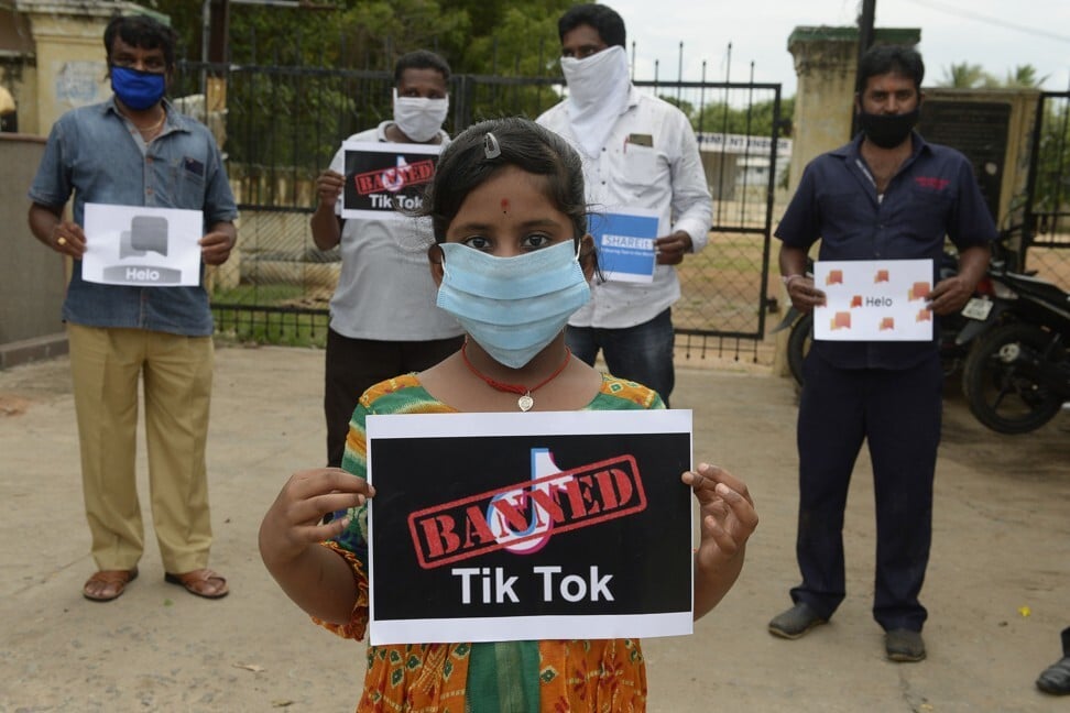 Members of a youth organisation in Hyderabad hold posters with the logos of Chinese apps in support of the Indian government’s ban on them. Photo: AFP