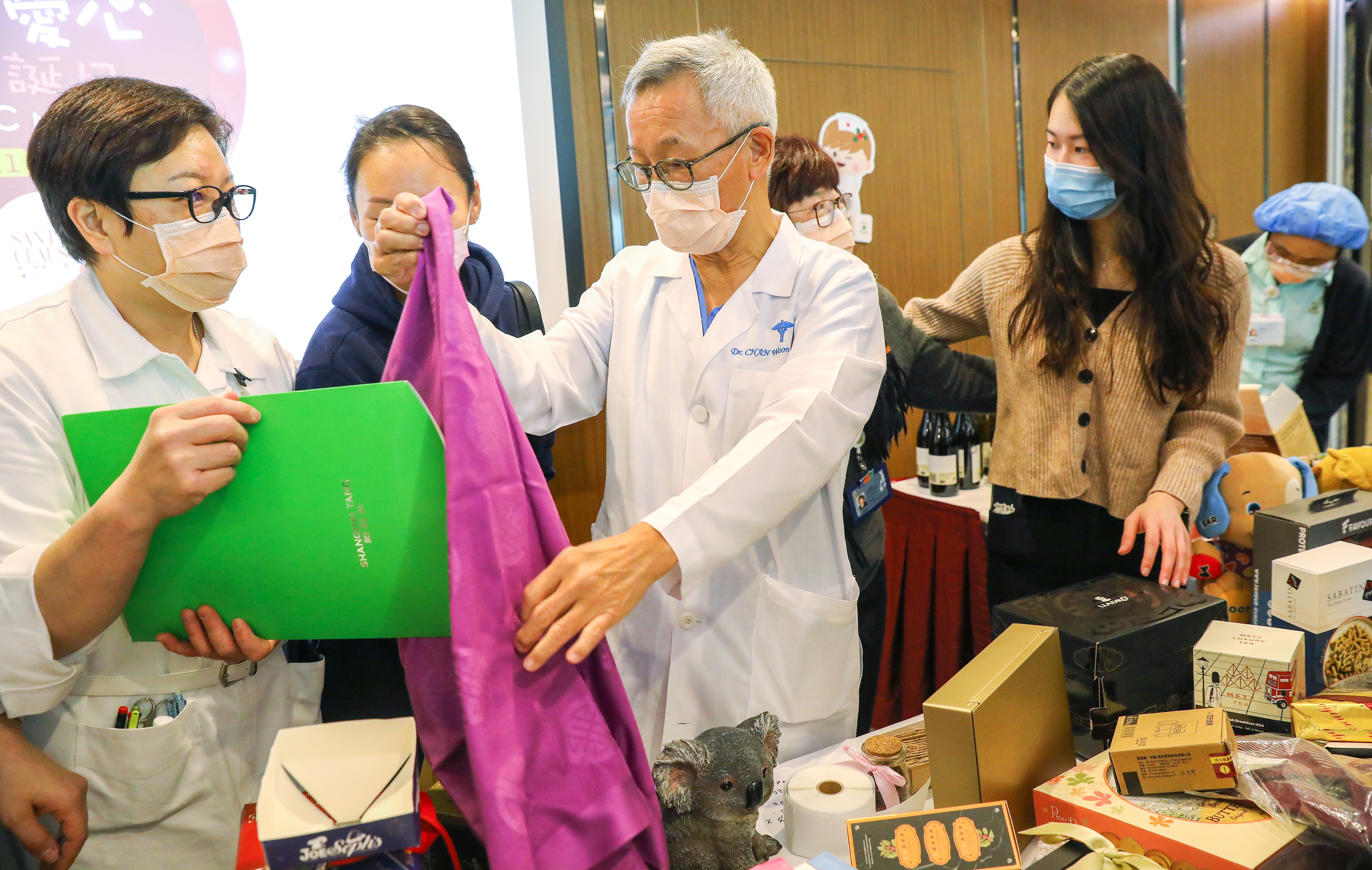 Dr Joseph Chan (centre), deputy Medical superintendent at Hong Kong Sanatorium and Hospital, attends charity bazaar for Operation Santa Claus in Happy Valley. Photo: Dickson Lee