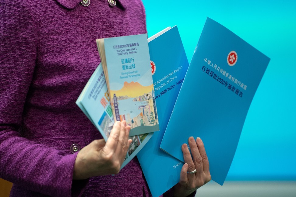 Hong Kong Chief Executive Carrie Lam with copies of her policy address during a news conference. Photo: SCMP Pictures