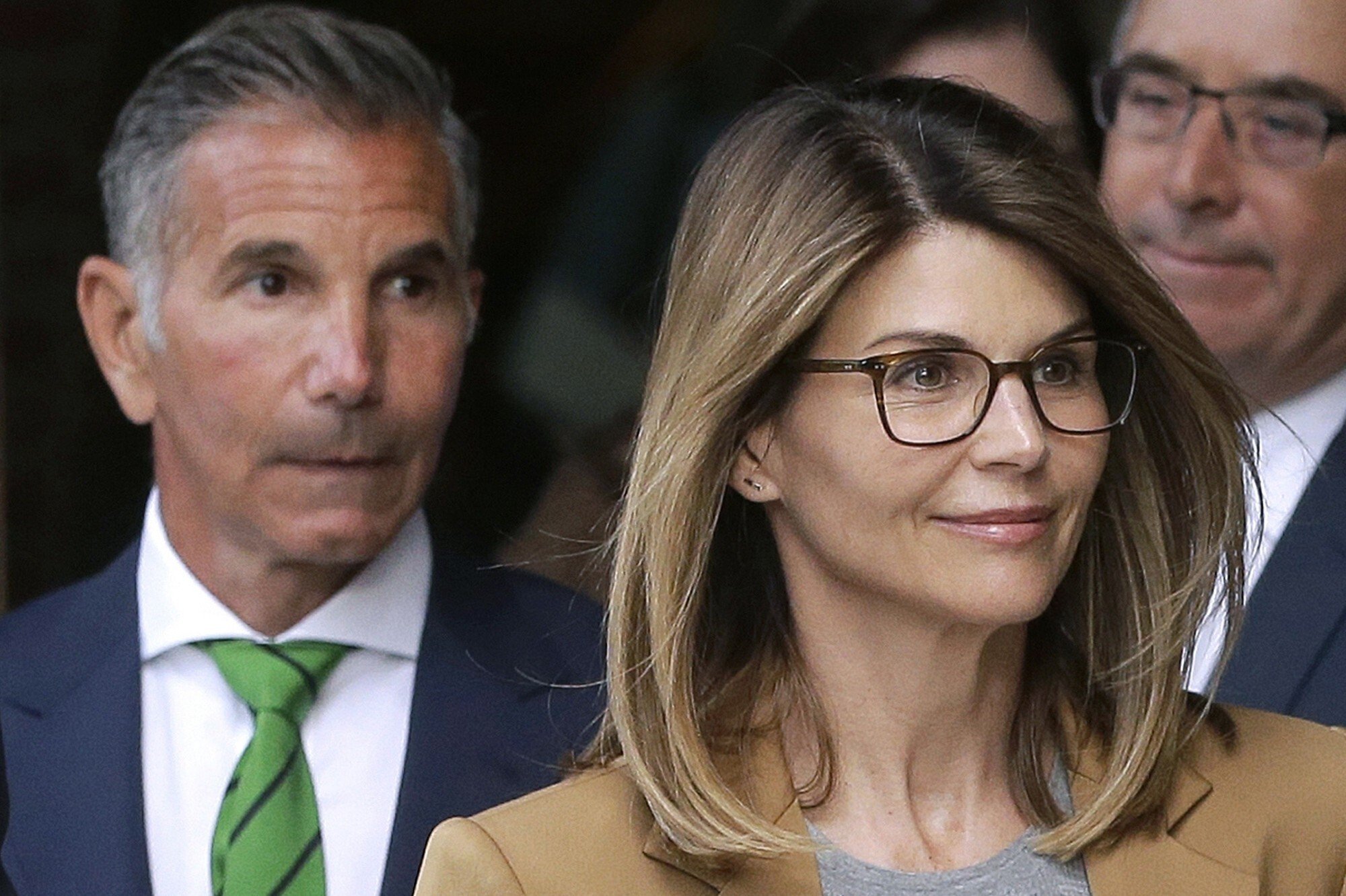 Actress Lori Loughlin and her husband, clothing designer Mossimo Giannulli, leave federal court in Boston in April 2019. Photo: AP