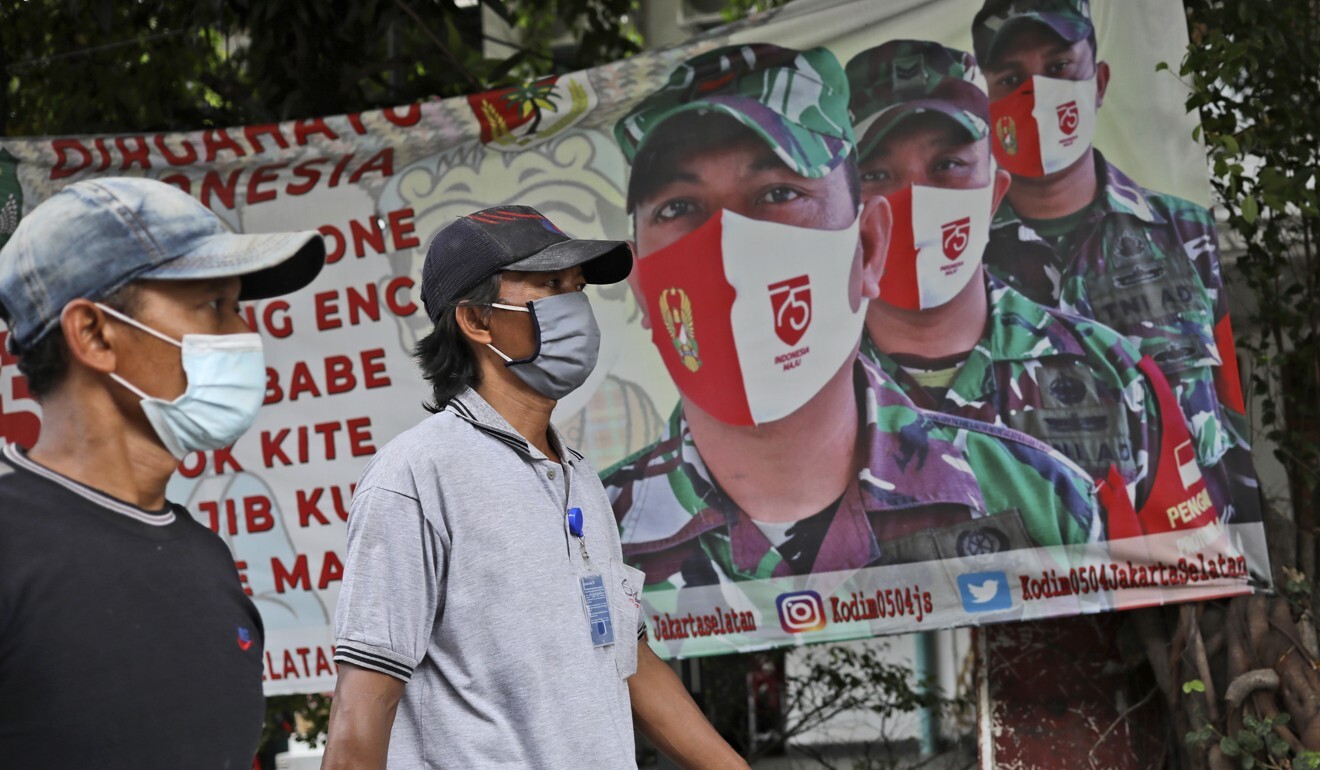 A poster in Jakarta calling for people to always have their mask on to prevent the spread of Covid-19. Photo: AP
