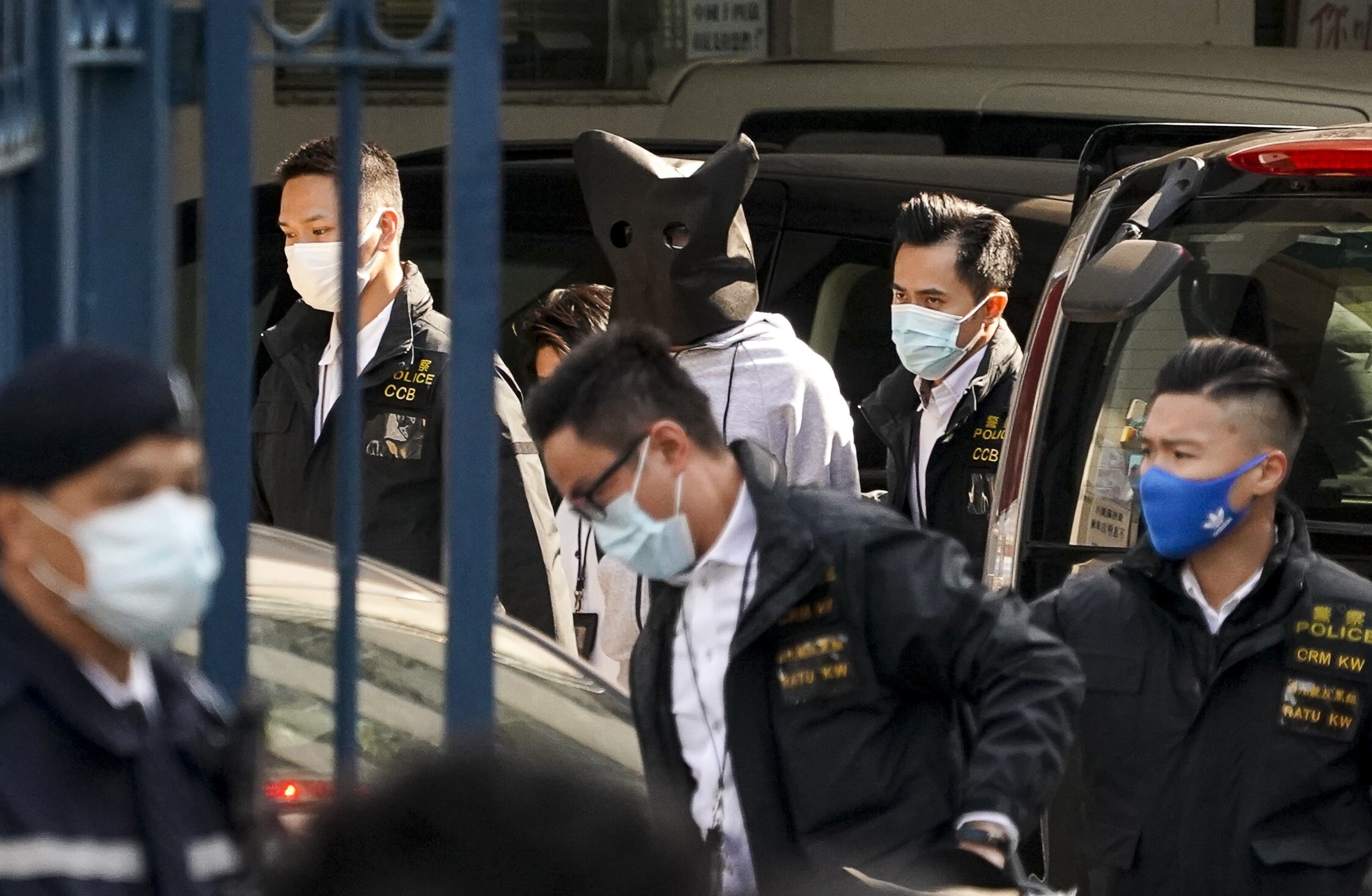 One of two teenage fugitives mainland Chinese authorities decided not to prosecute arrives at Hong Kong’s Tin Shui Wai police station. Photo: Felix Wong