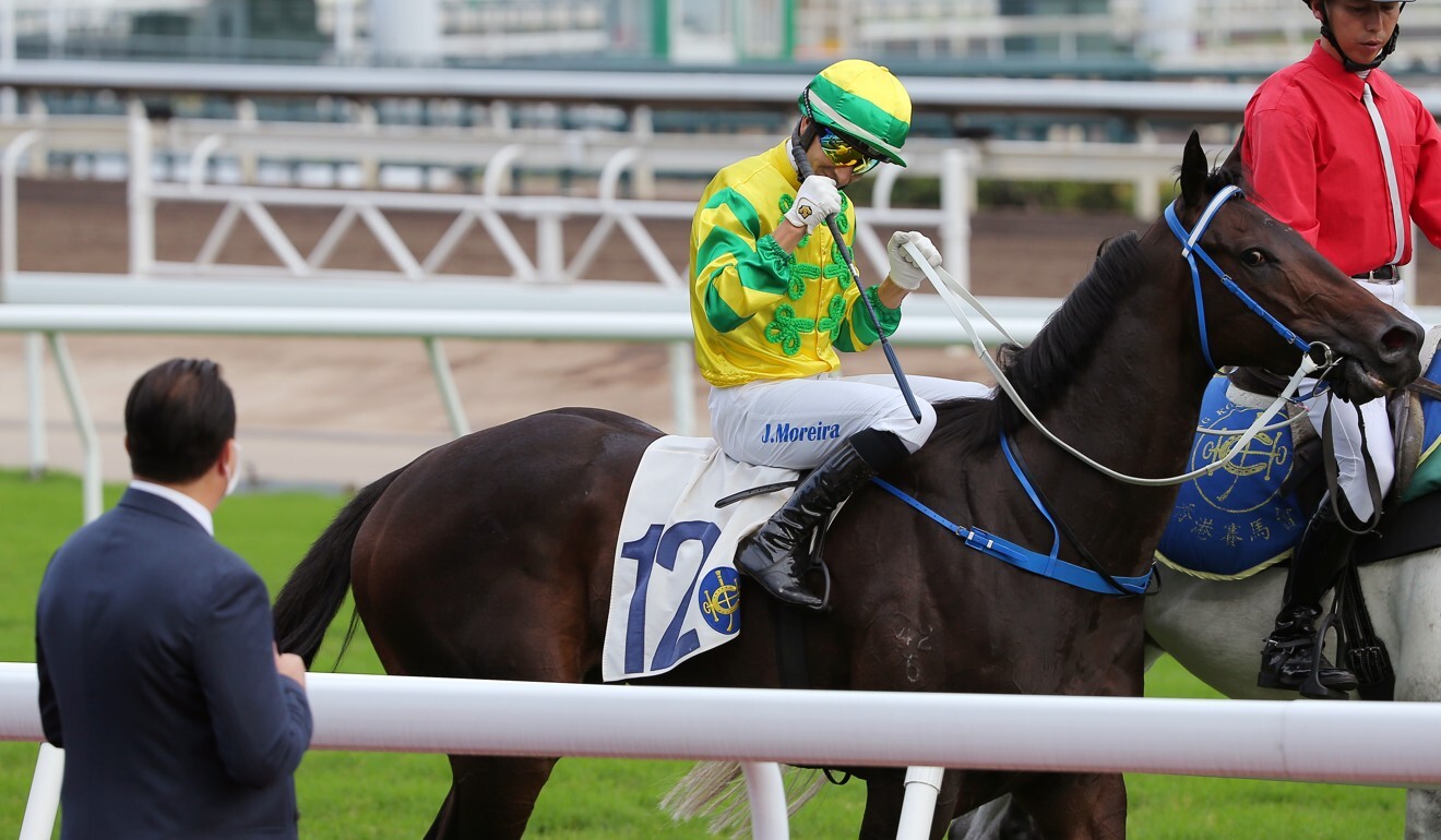 Jockey Joao Moreira and trainer Caspar Fownes celebrate Sky Darci’s Chevalier Cup victory.