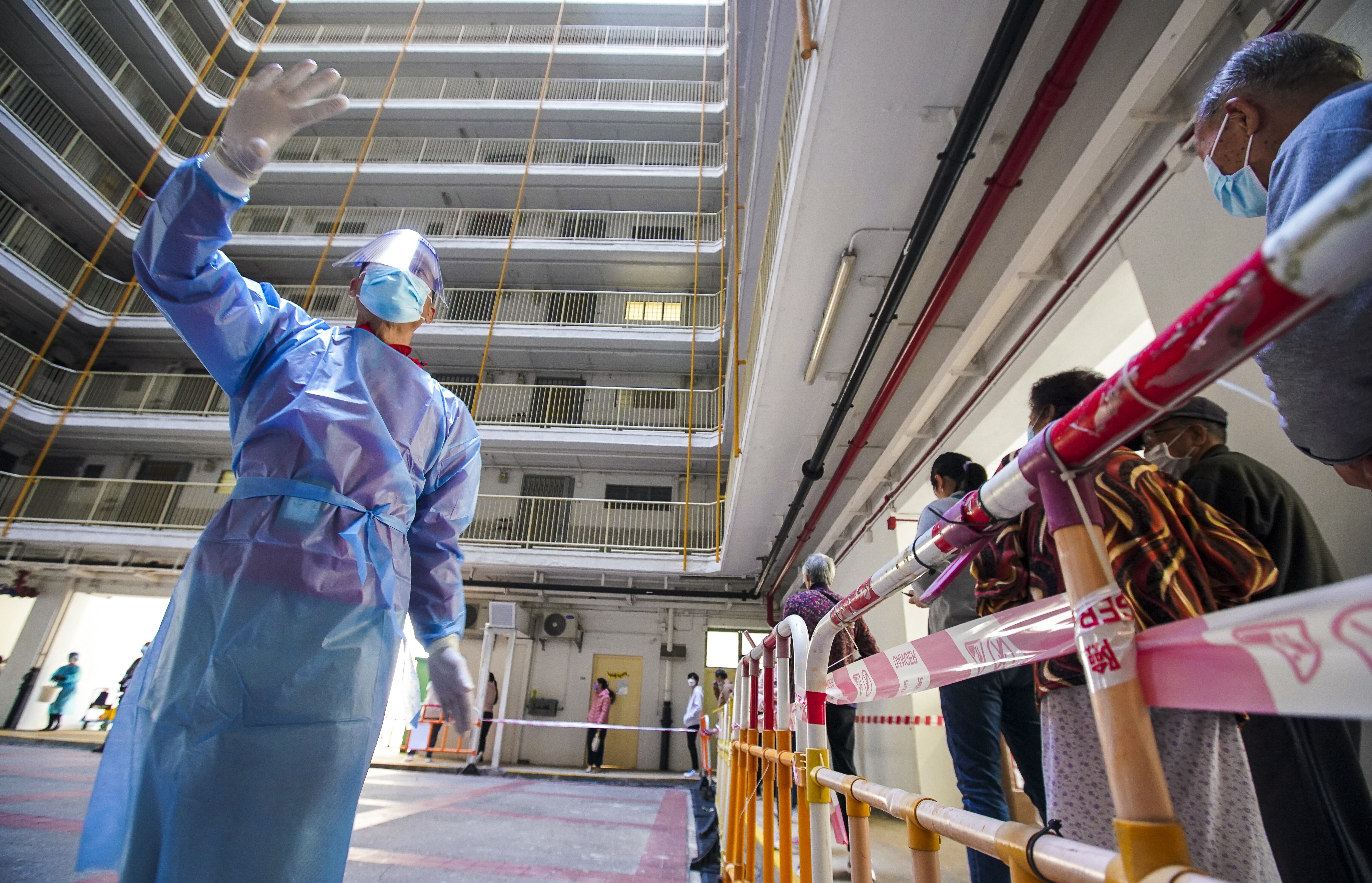 Swab samples are collected at a mobile Covid-19 testing point at Fung Chak House in Wong Tai Sin. Photo: Felix Wong