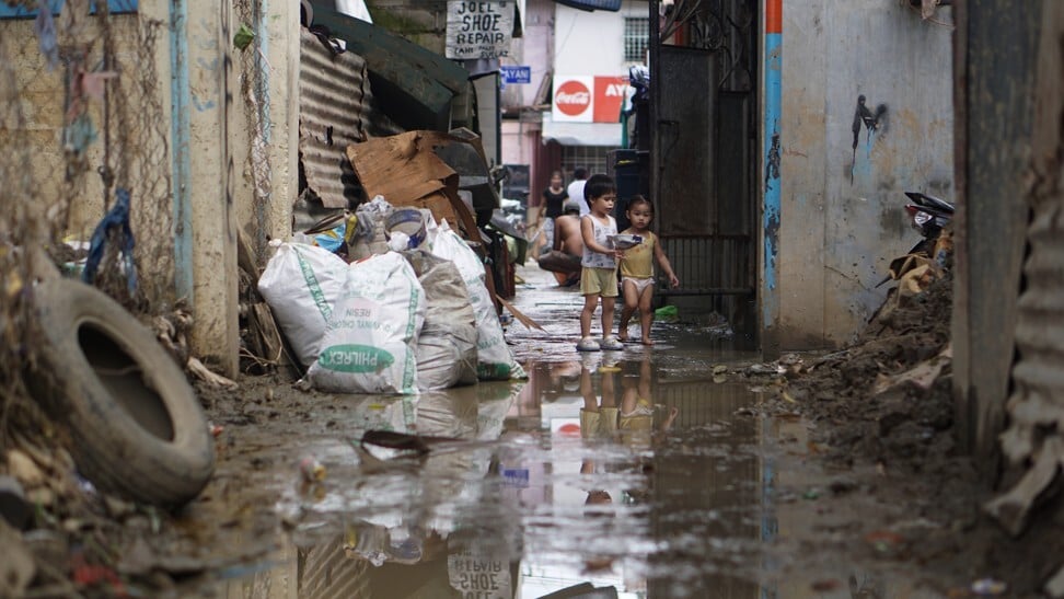 As victims of typhoon-prone Philippines’ worst floods in 50 years clean ...