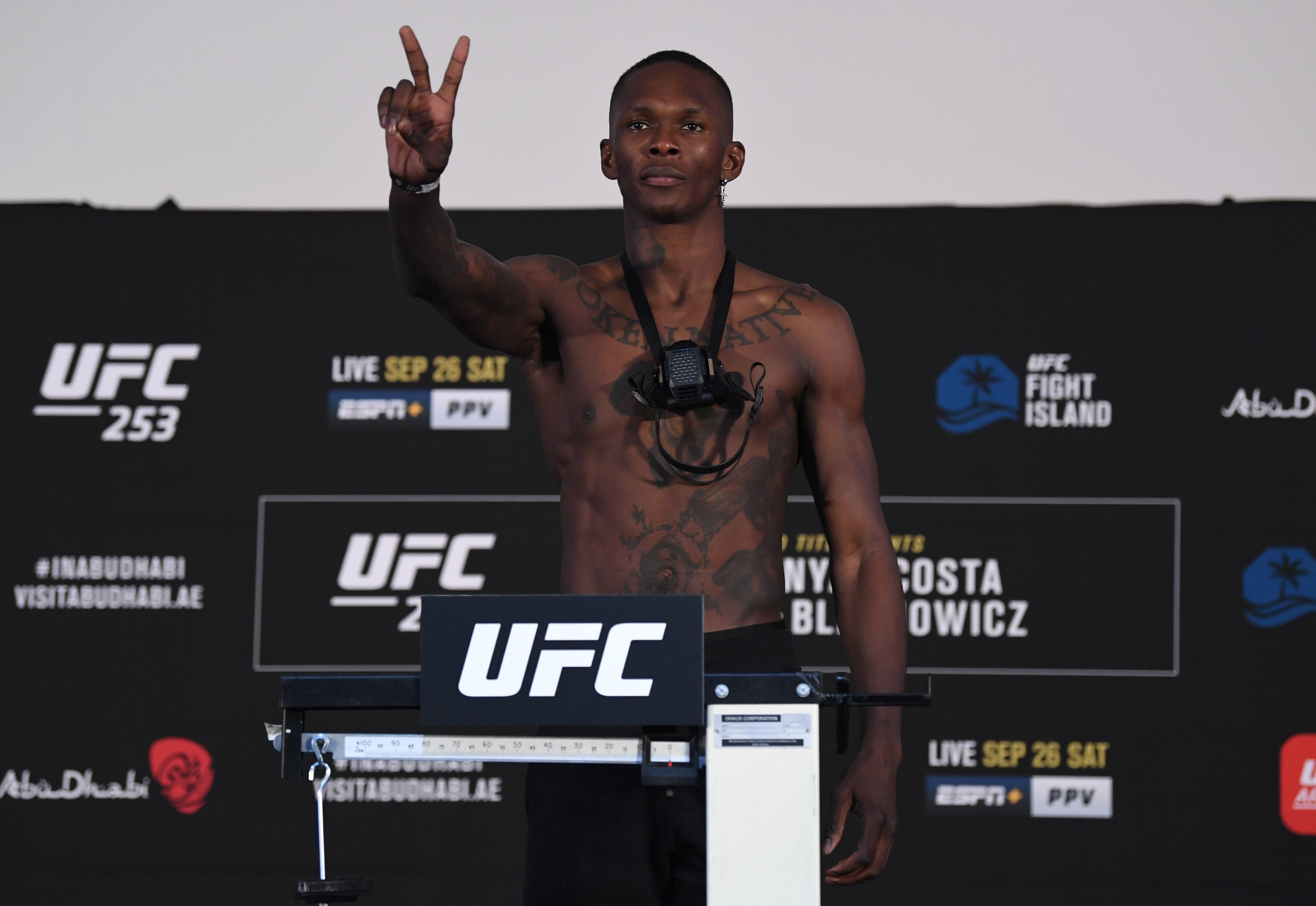 Israel Adesanya poses on the scale during the UFC 253 weigh-in on September 25, 2020 at Flash Forum on UFC Fight Island, Abu Dhabi, United Arab Emirates. Photo: Josh Hedges/Zuffa LLC via Getty Images