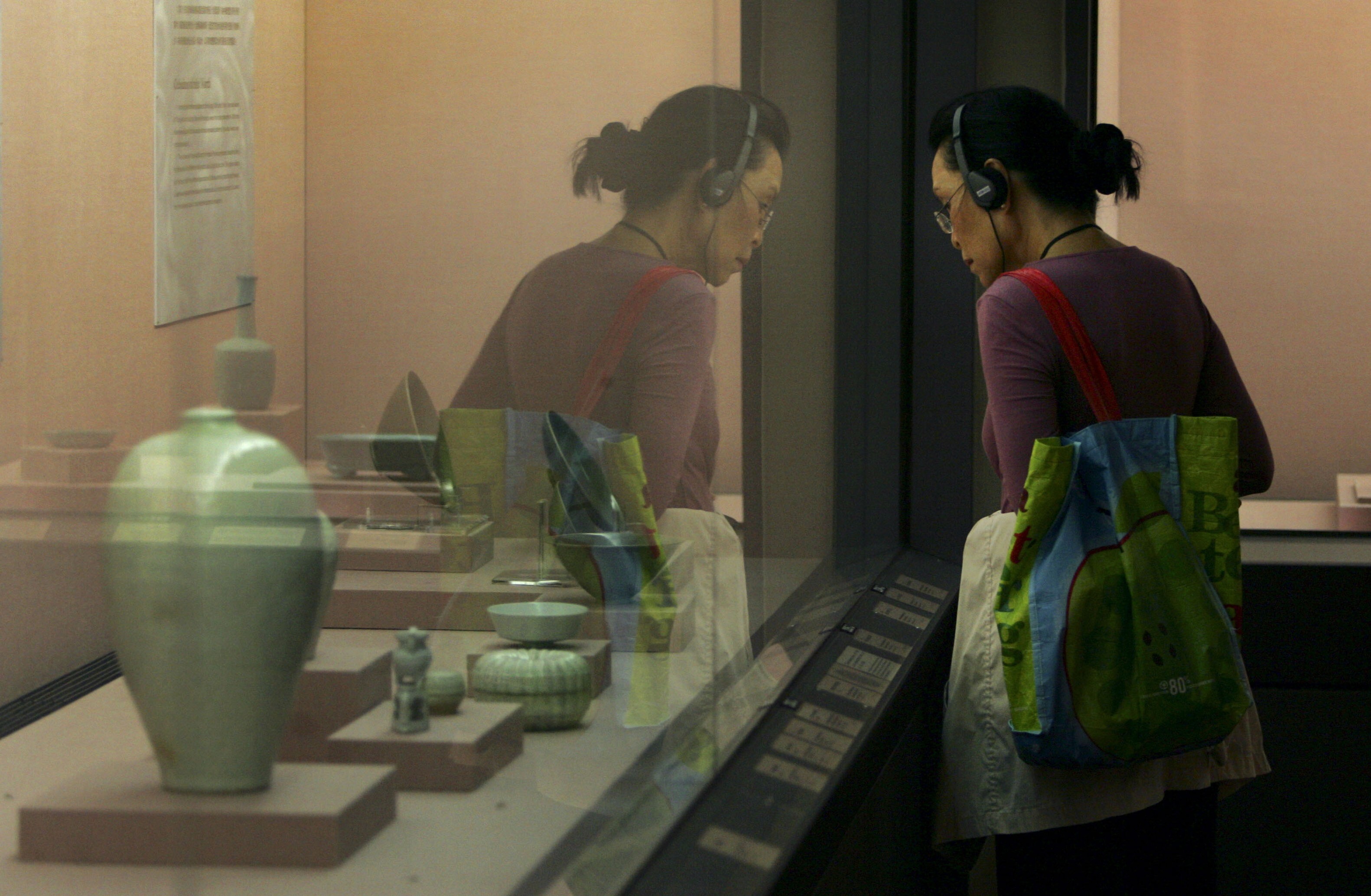 A visitor admires exhibits at the National Palace Museum in Taipei, Taiwan, in April 2009. The internationally renowned museum houses artefacts from China’s imperial era. Photo: AP