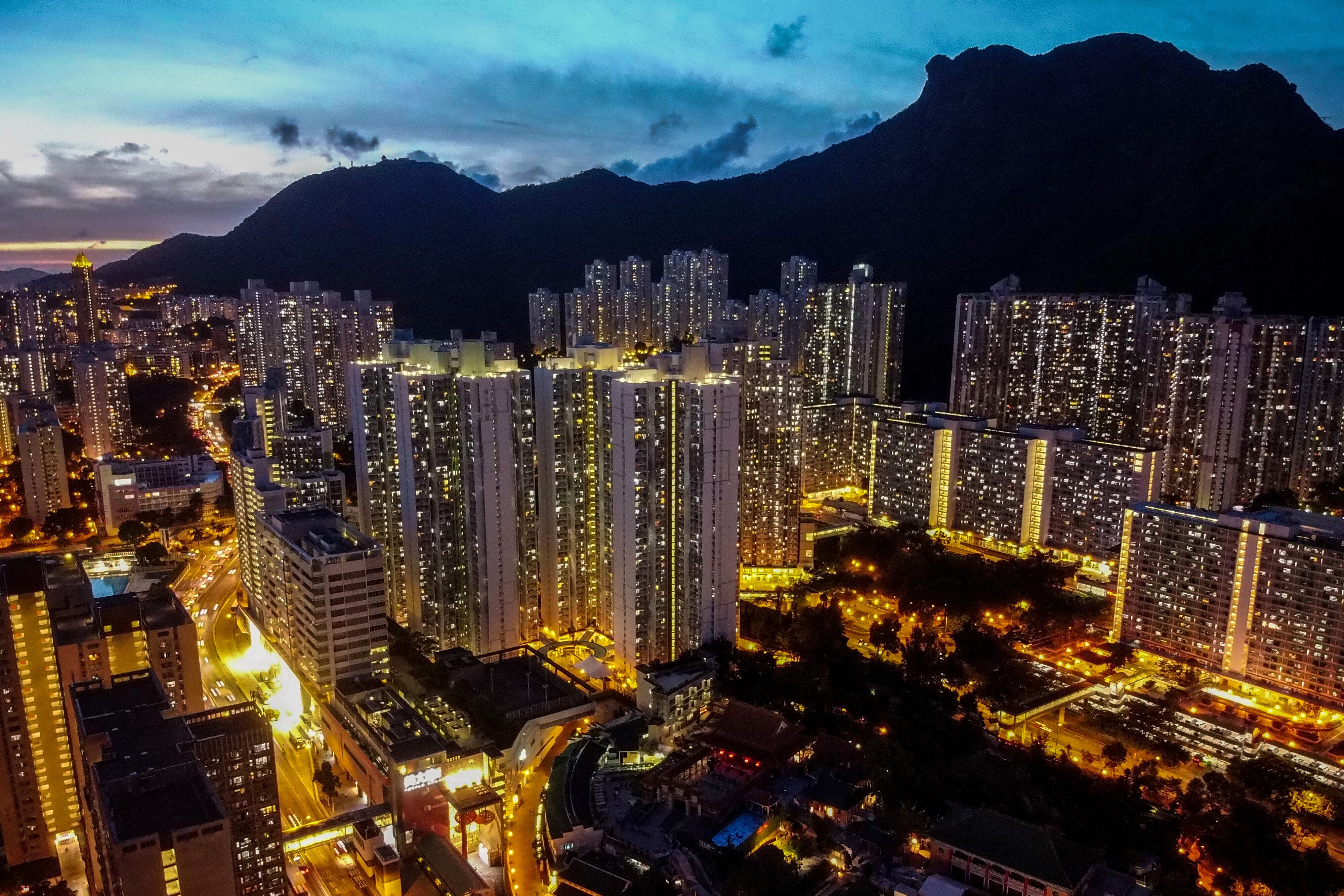 Hong Kong’s residential buildings gleam in the twilight in Wong Tai Sin on Kowloon. Hong Kong has for years held the dubious distinction of being world’s least affordable housing market. Photo: Sun Yeung